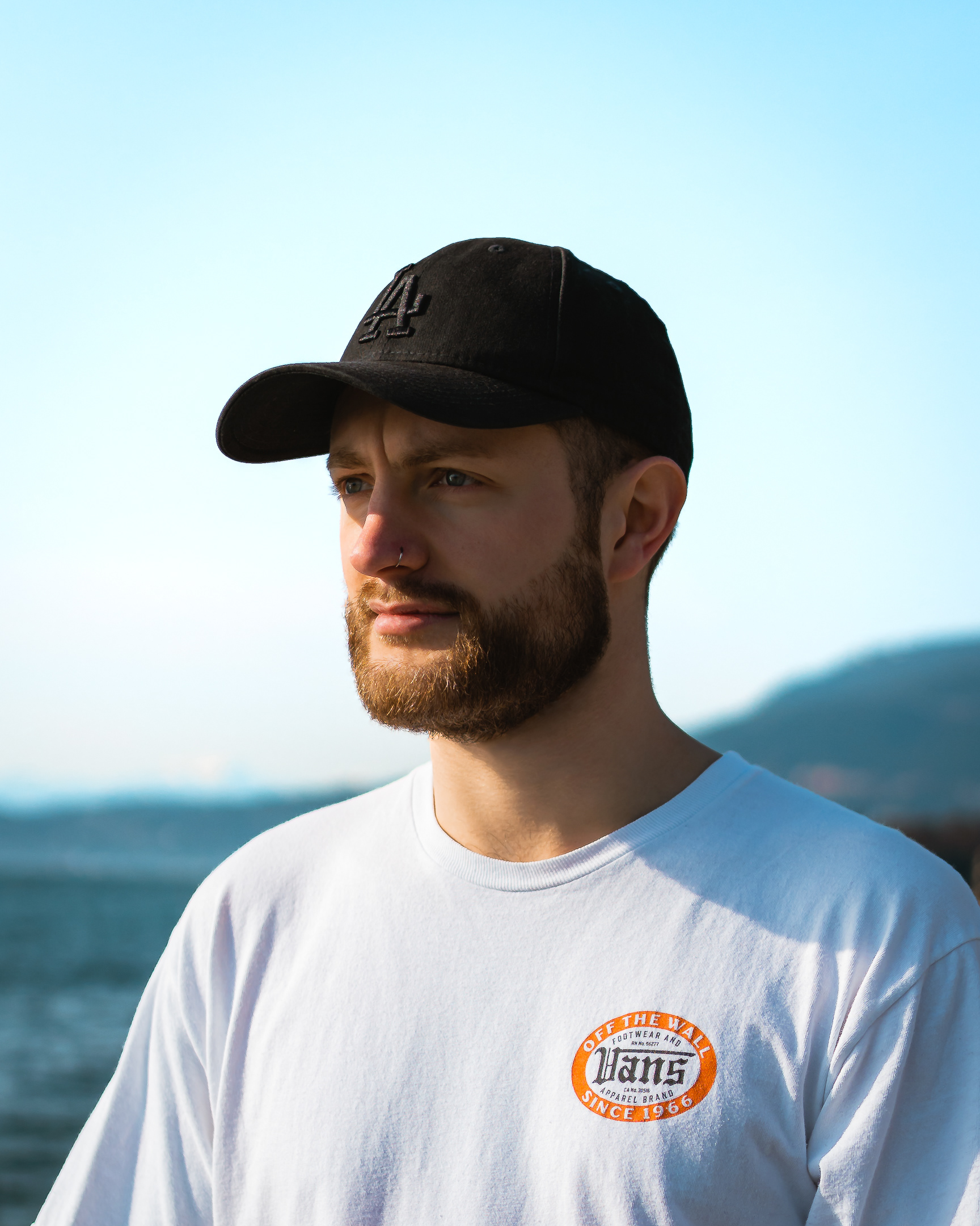 Simon Cousins automotive photographer wearing white tshirt and black baseball cap
