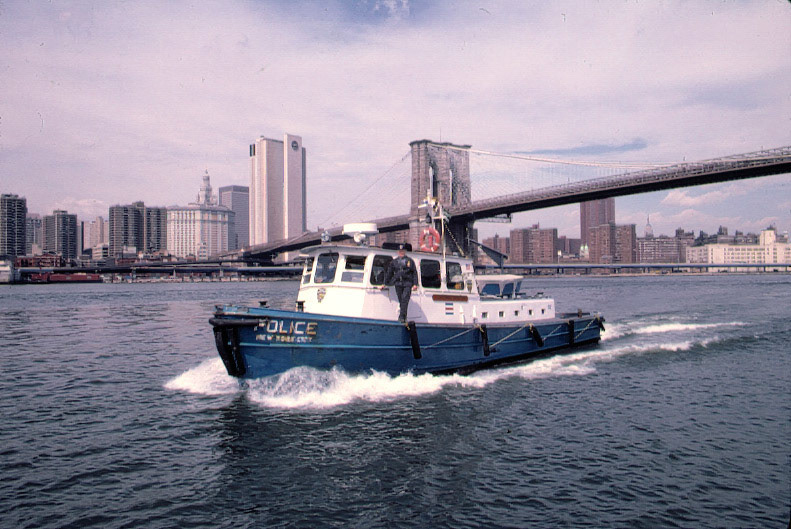 Sgt. Howard Smith aboard Launch No 7 (Harbor Charlie)