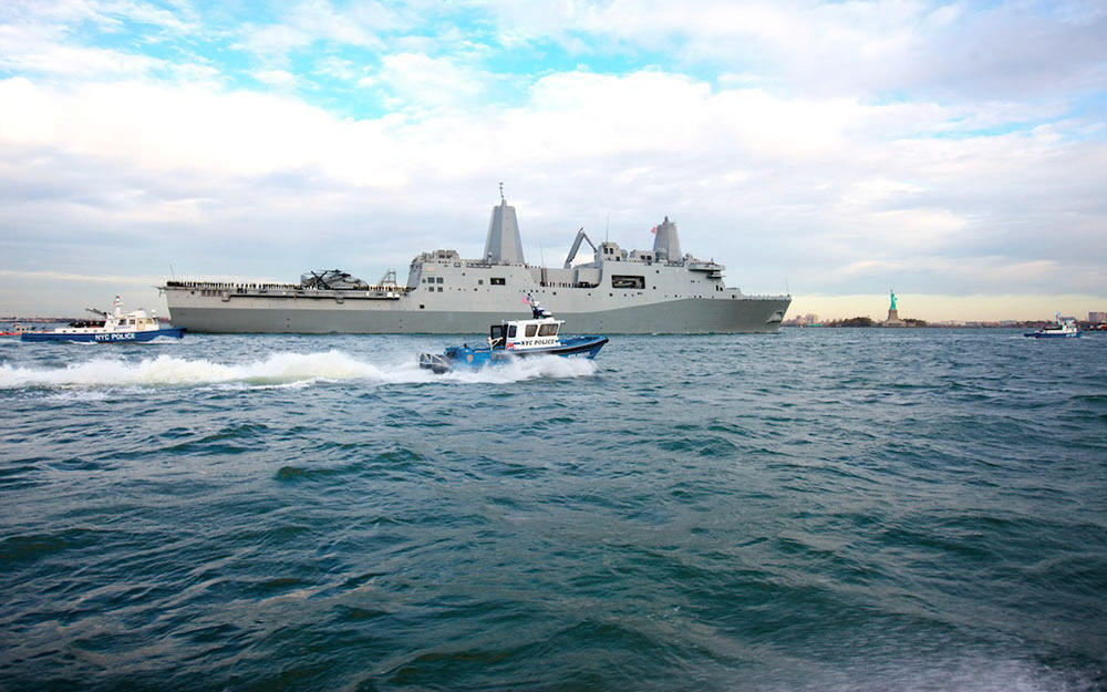 NYPD Harbor launches escort USS New York into NY Harbor for the first time.