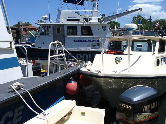 Launches tied up at Adam base for training