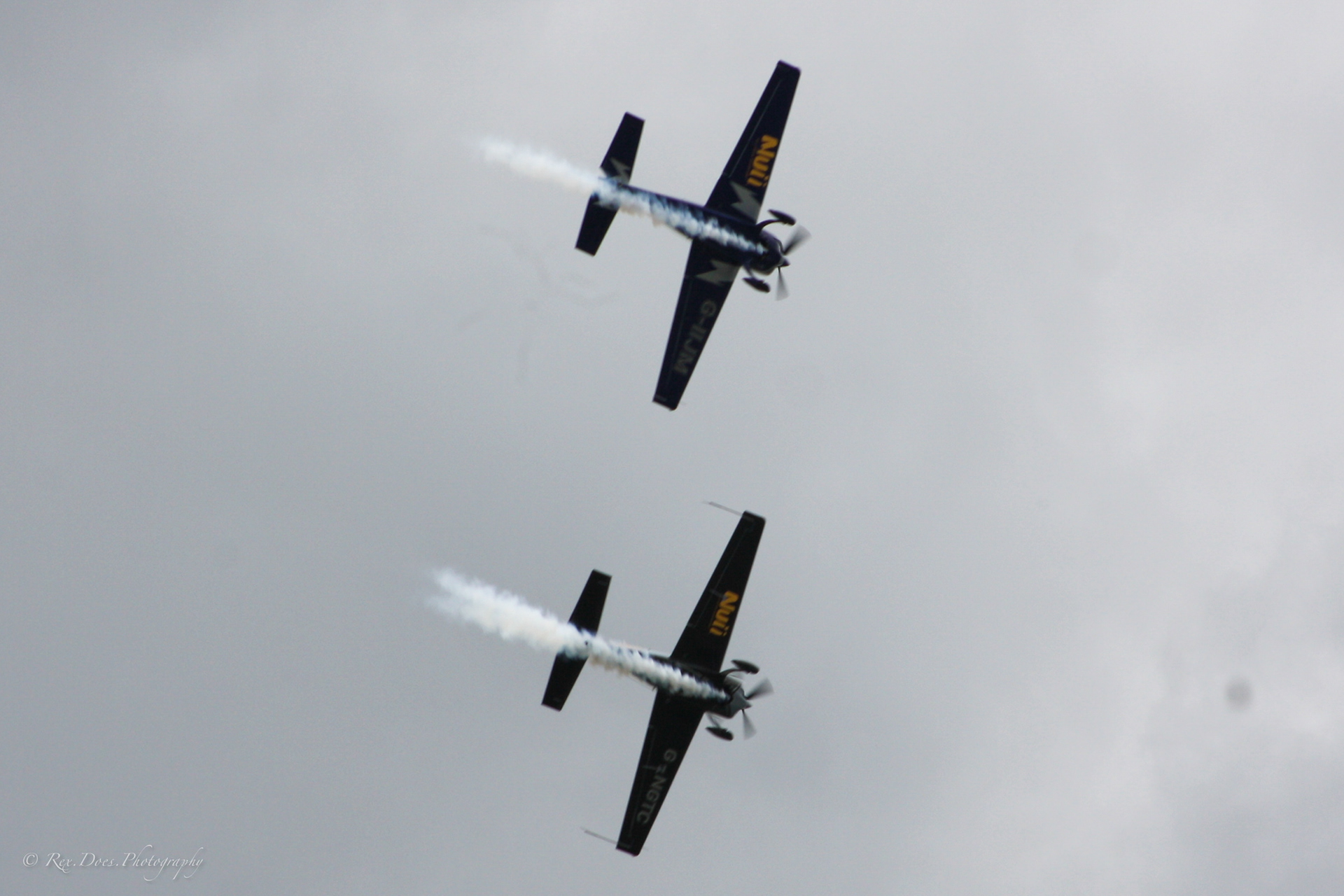 2 Extra 330's flying in formation