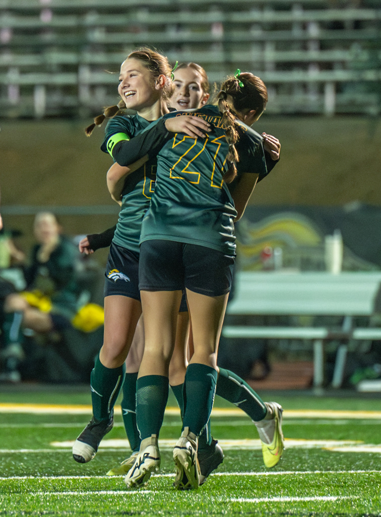 Argonaut High School girls celebrate soccer goal. Photo by Duv Cardenas in Jackson, CA.