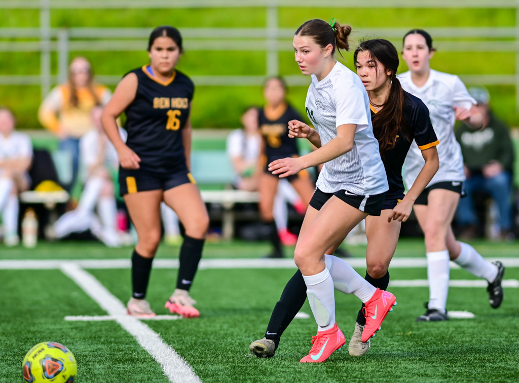 Argonaut and Ben Holt High School girls varsity soccer players battle for the ball during playoff game against Ben Holt. Photo by Duv Cardenas at the Lodi Grape Bowl