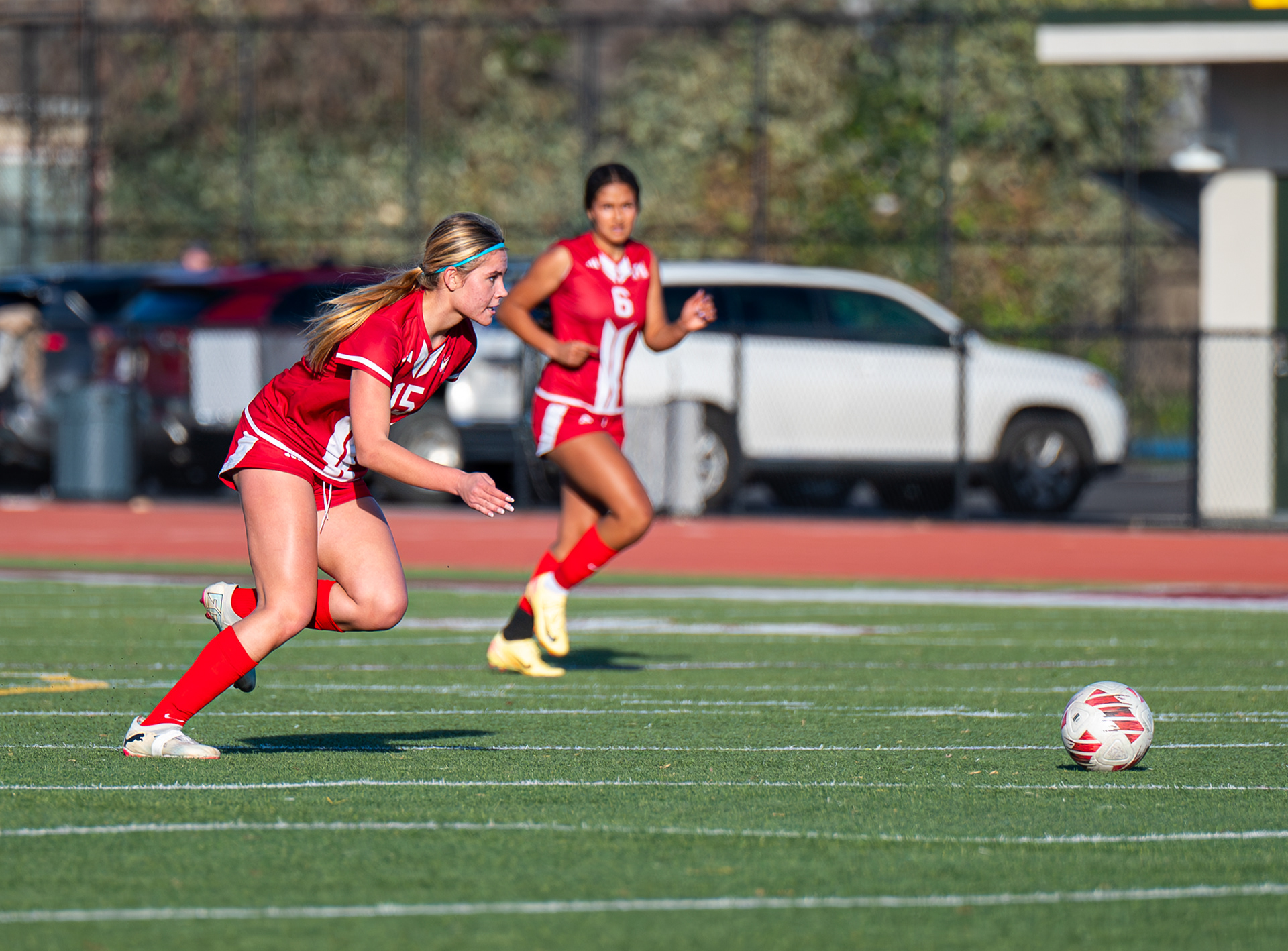 McClatchy girls soccer player charges to control the ball. Photo by Duv Cardenas in Sacramento, CA.