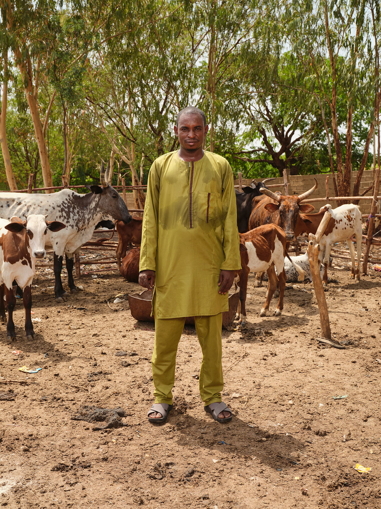 Oumar Tapp has been living in the Sénou camp for displaced persons for seven years. He raises livestock, feeding them cotton waste. Bamako, May 2025