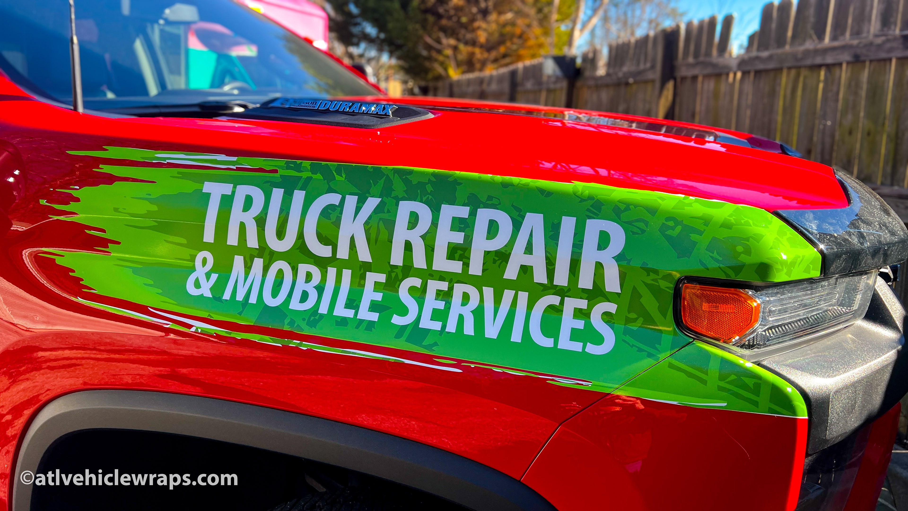 Close-up of the premium 3M vinyl and professional finish on the Chevrolet 3500 truck graphics.