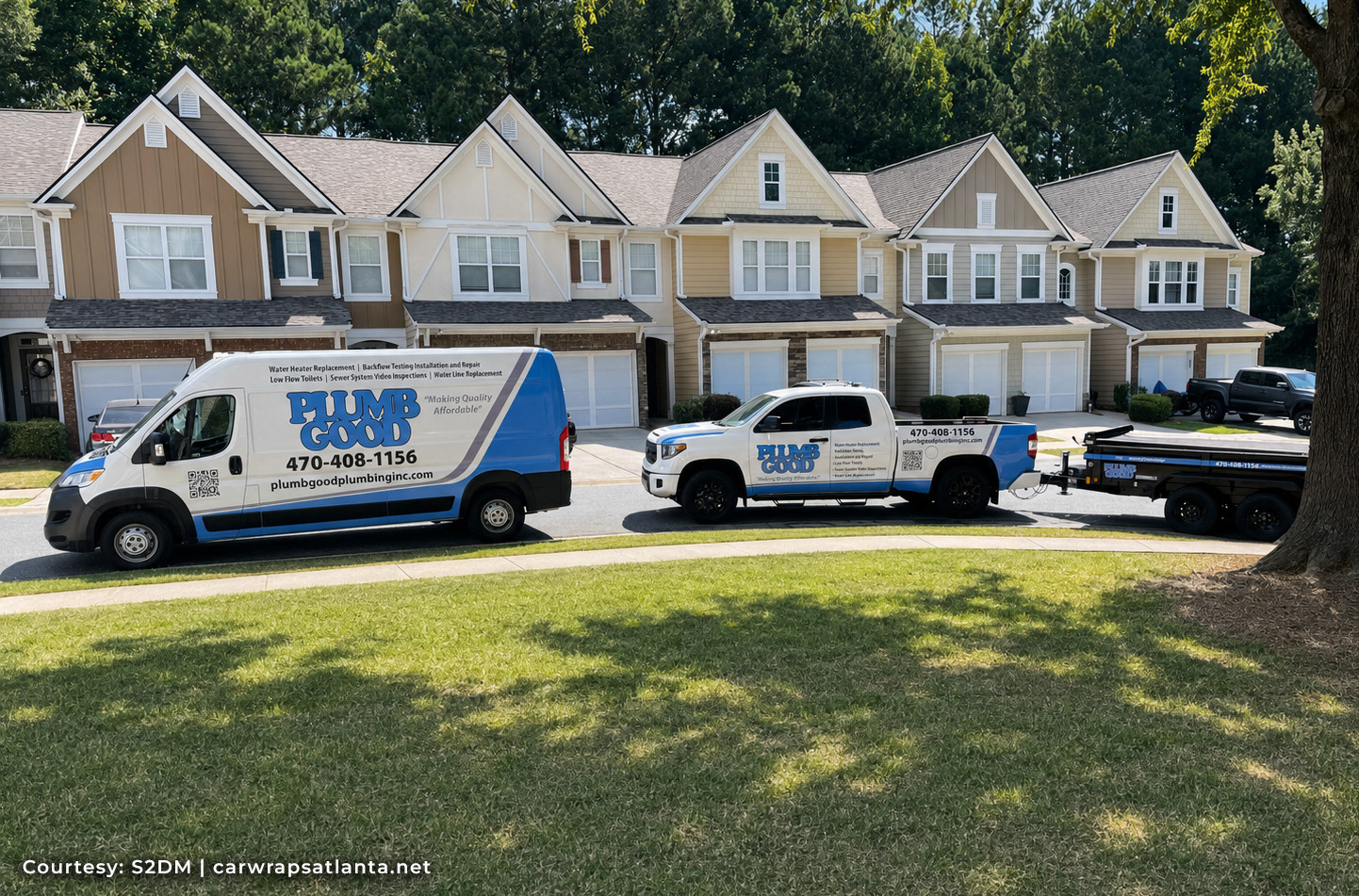 Fleet wraps in Atlanta showing consistent company branding across a commercial van, pickup truck and work trailer.