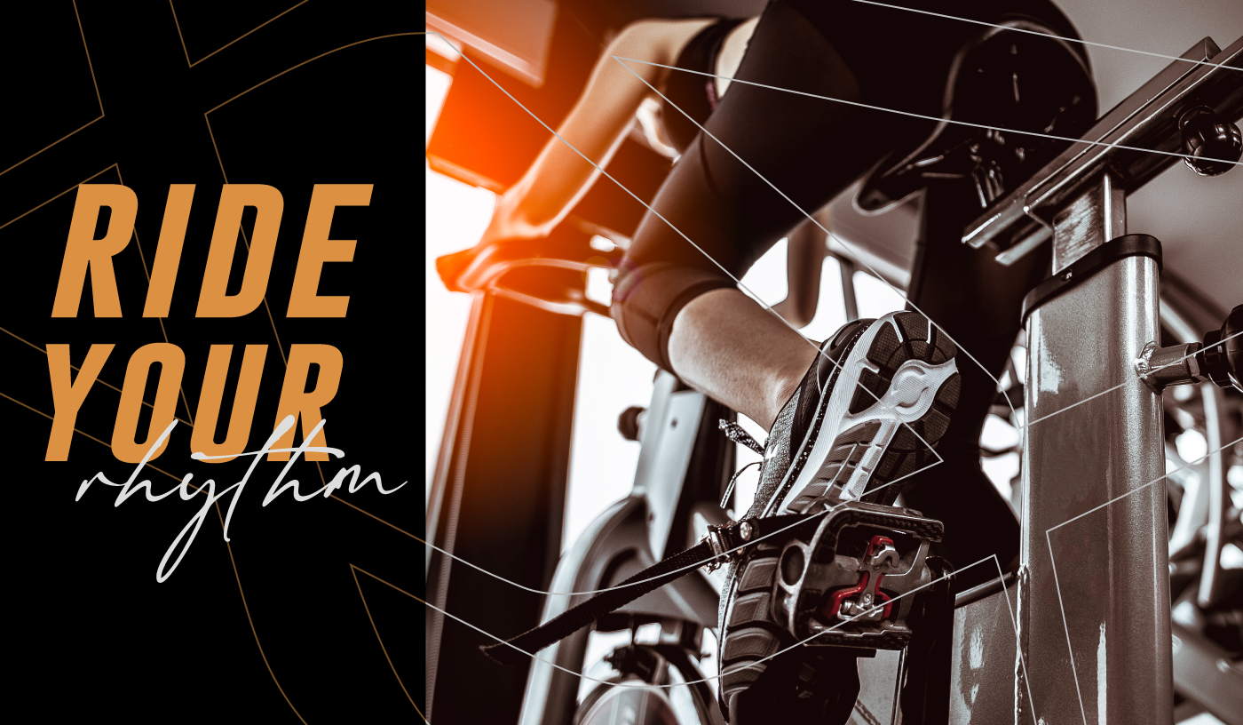 woman cycling in stationary bike in the gym, angle shot from above, ride your rhythm