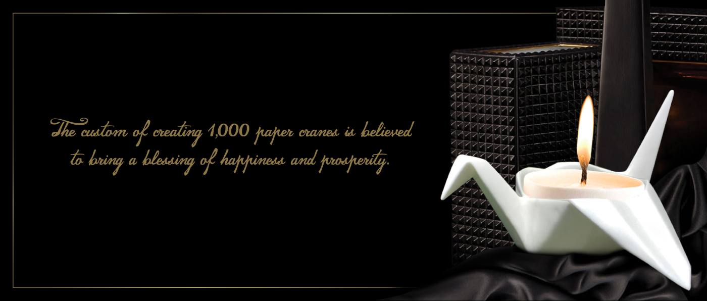 black and gold premium branding with fine bone china origami crane candle holder and black textured display items