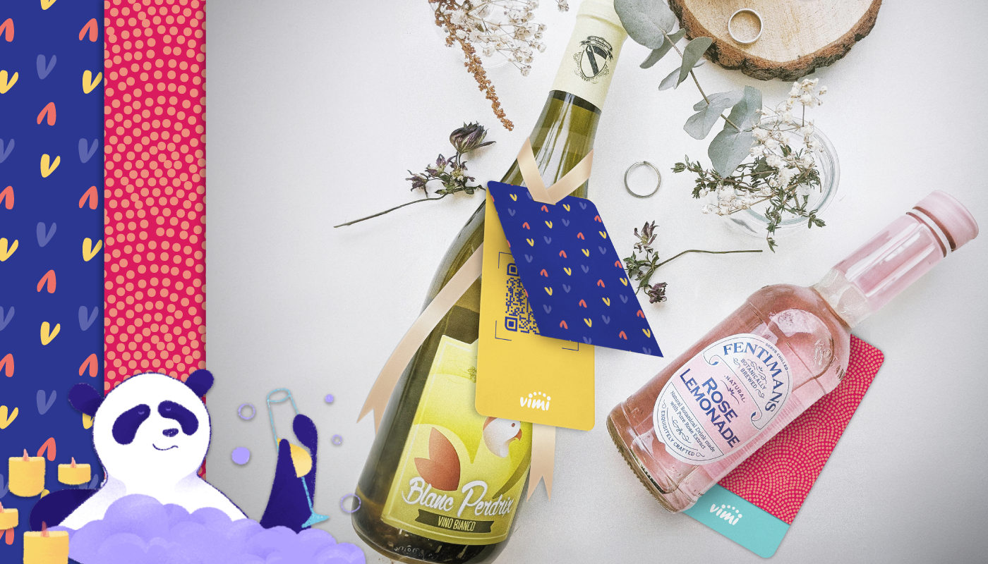 wine bottle with a gift tag with colorful heart pattern, and a polkadot colorful pattern, with a panda bathing