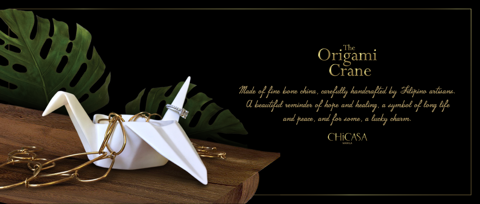 premium gold and black branding the origami crane japanese concept elegant and luxurious concept by chicasa manila, fine bone china gift item with gold accessories and wooden platform and mosterra leaves