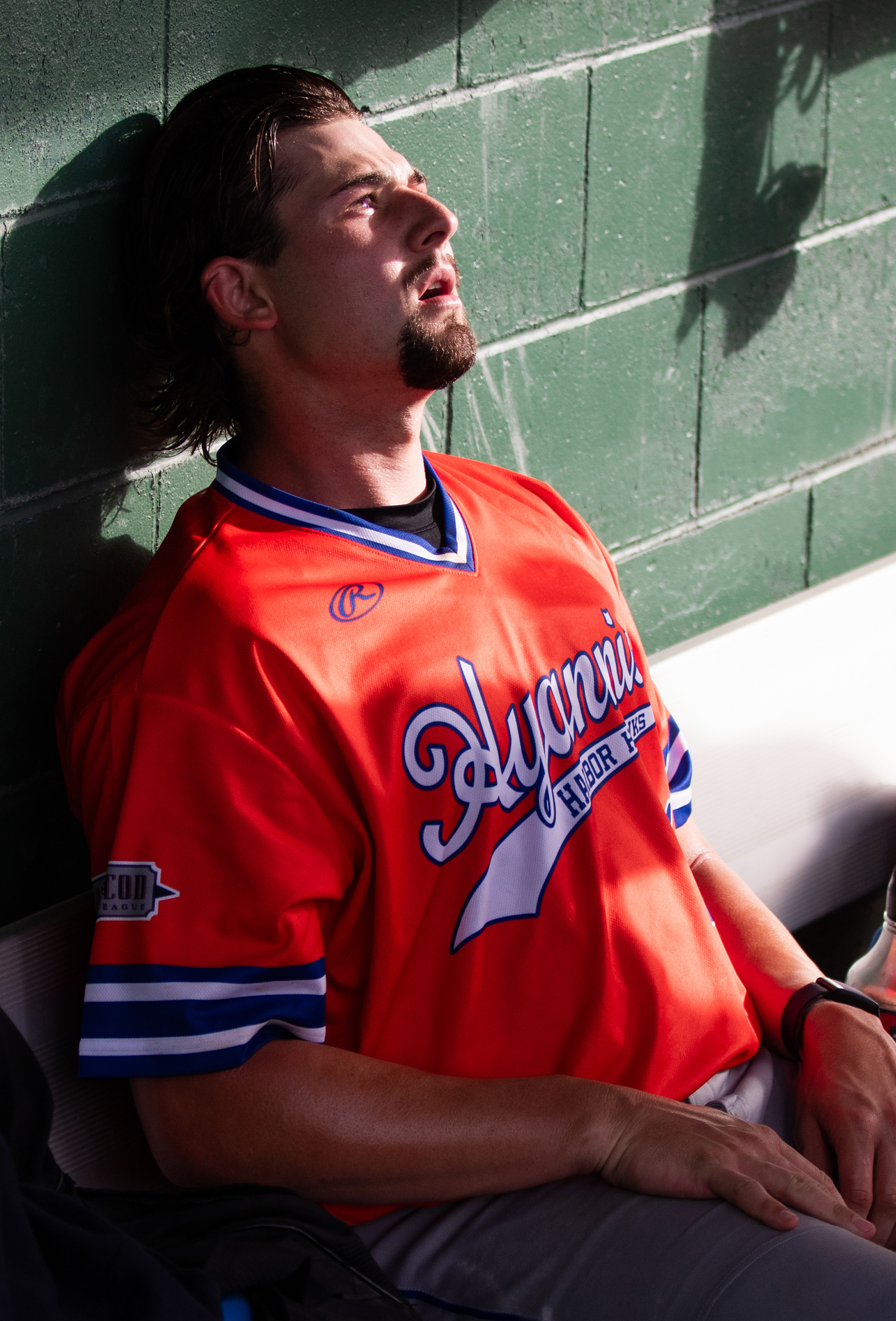Hyannis pitcher Zach Voelker slumps in the dugout after the sixth inning of a Cape Cod Baseball League game against the Wareham Gatemen on July 9, 2023, in Wareham, Mass.