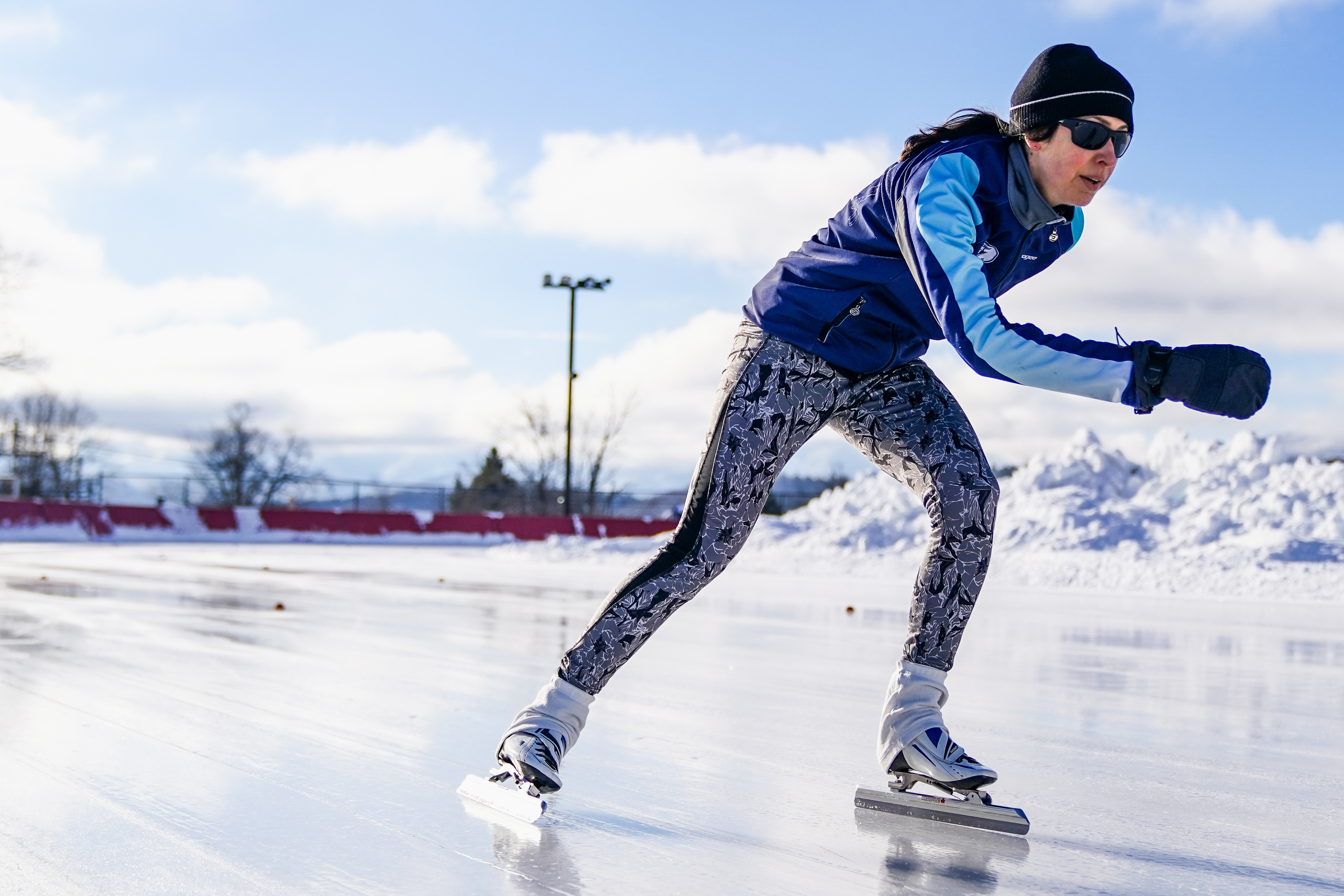 An outdoor speedskating athlete races on the Olympic Speed Skating Oval during the Empire State Winter Games in Lake Placid, N.Y., on Feb. 3, 2024.