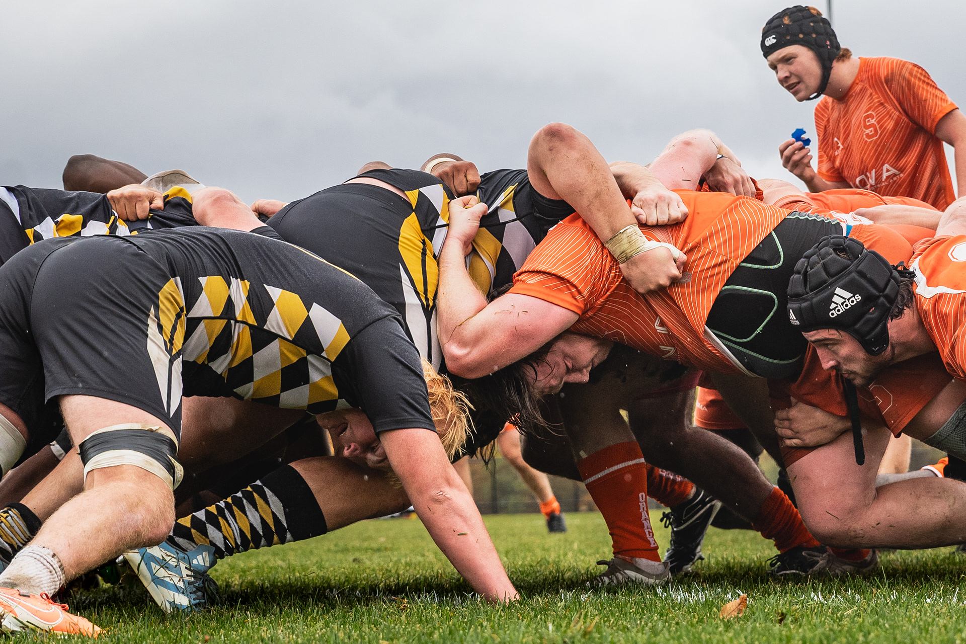 During a match against American International College, Patrick prepares for a scrum on Oct. 25, 2026. Rugby’s physical nature creates deeper bonds between Patrick and his teammates, who put their bodies on the line for each other every day. “I have so much respect for people that are actually gonna just get out on the field with me and put their bodies on the line. When you see that when you see someone that you just met three weeks ago go and get absolutely crunched, you're just like, damn. I love you.”