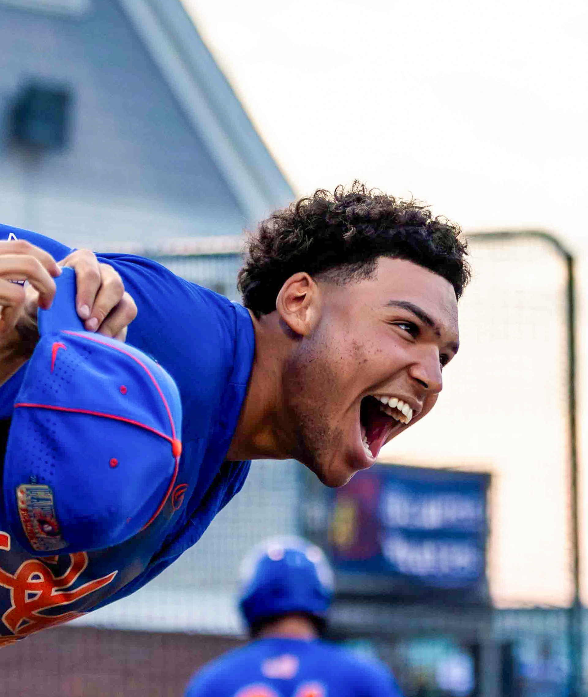 Hyannis Harbor Hawks' Cameron Smith cheers on his Cape Cod Baseball League teammates against the Bourne Braves on June 30, 2023, in Bourne, Mass.