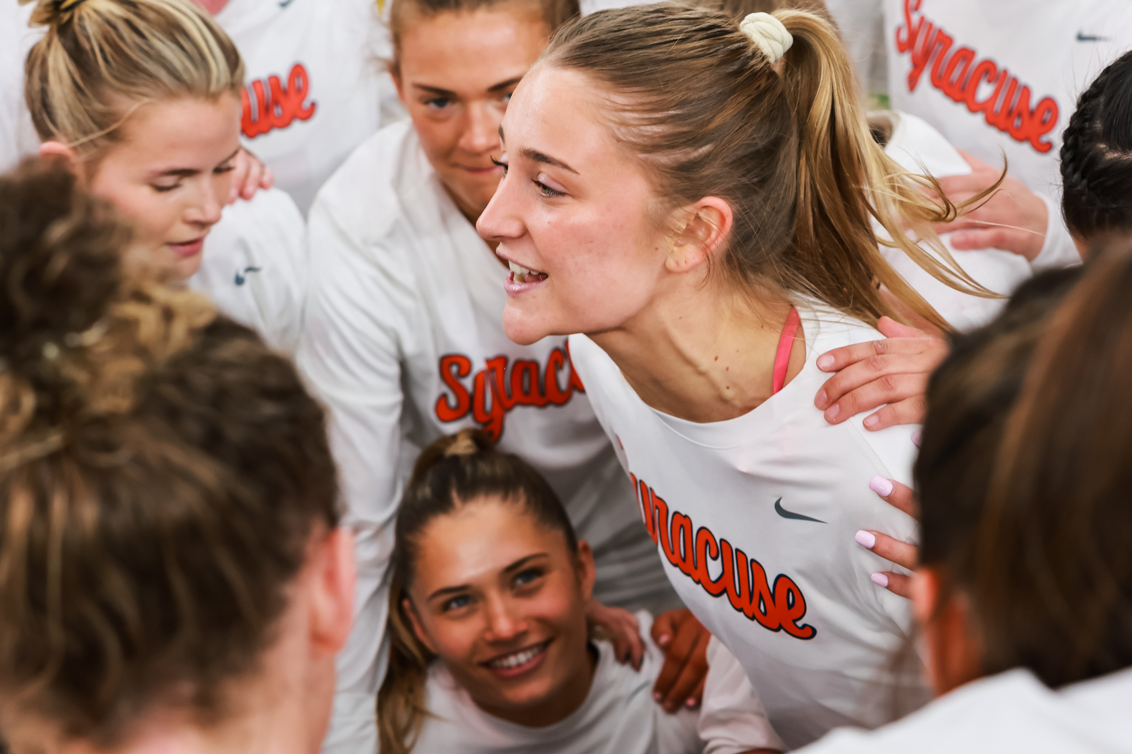 Syracuse lacrosse player Ella Blesi (25) gathers her teammates for a pep talk before the 10th-ranked Orange upset seventh-ranked Yale on March 17, 2026, in Syracuse, N.Y.