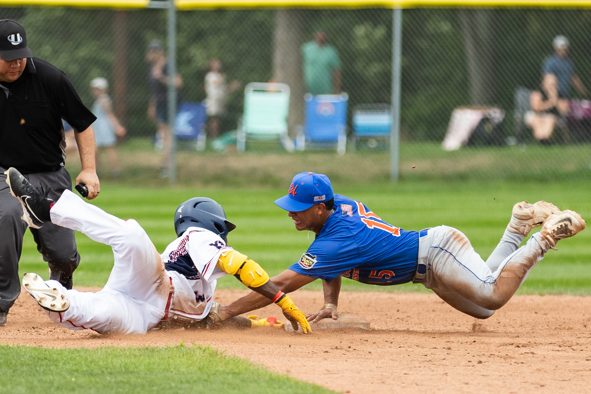 Hyannis Harbor Hawks’ J.P. Acosta tags out Yarmouth-Dennis’ Skylar King at second as he attempts to turn a single into a double on Aug. 4, 2024, in Yarmouth, Mass. Hyannis won 7-1.