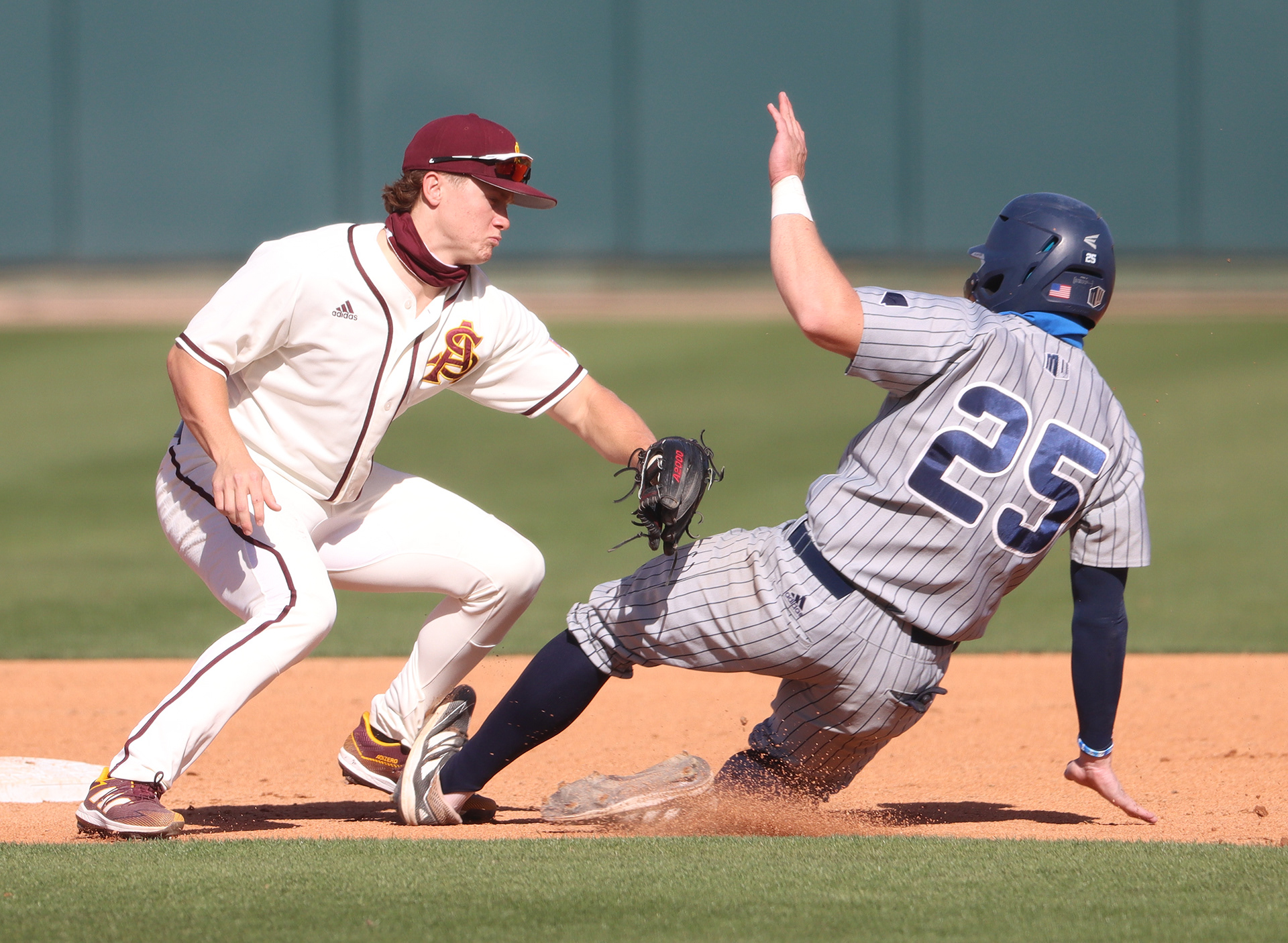 Arizona State second baseman Sean McLain applies a tag on Nevada first baseman Dillan Shrum during a game on March 2, 2021, at Phoenix Municipal Stadium.