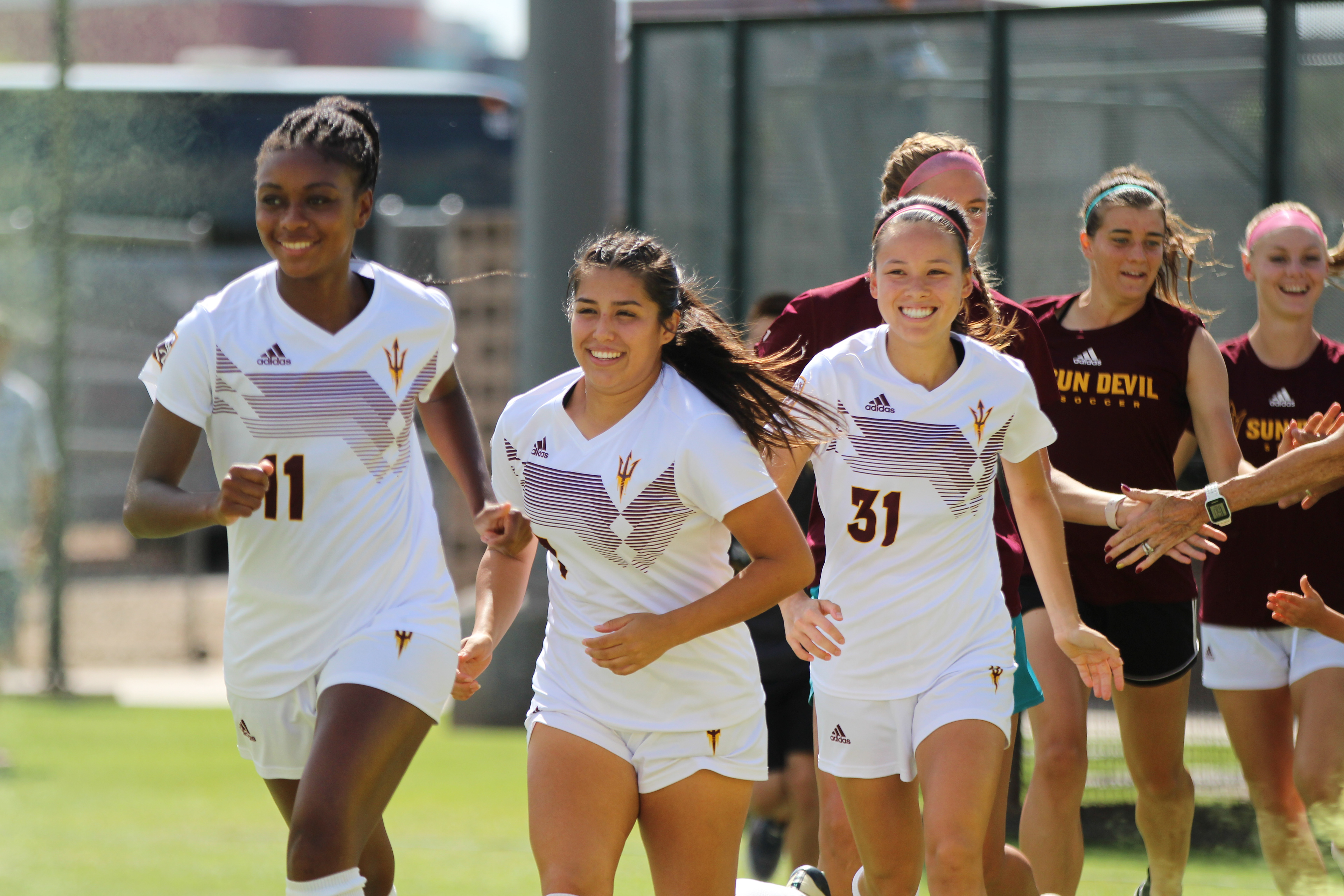 Arizona State soccer players Lorato Sargeant (11), Adriana Orozco (7) and Jessica Hale (31) take the field for a match against Utah on Sept. 27, 2021, in Tempe, Ariz.