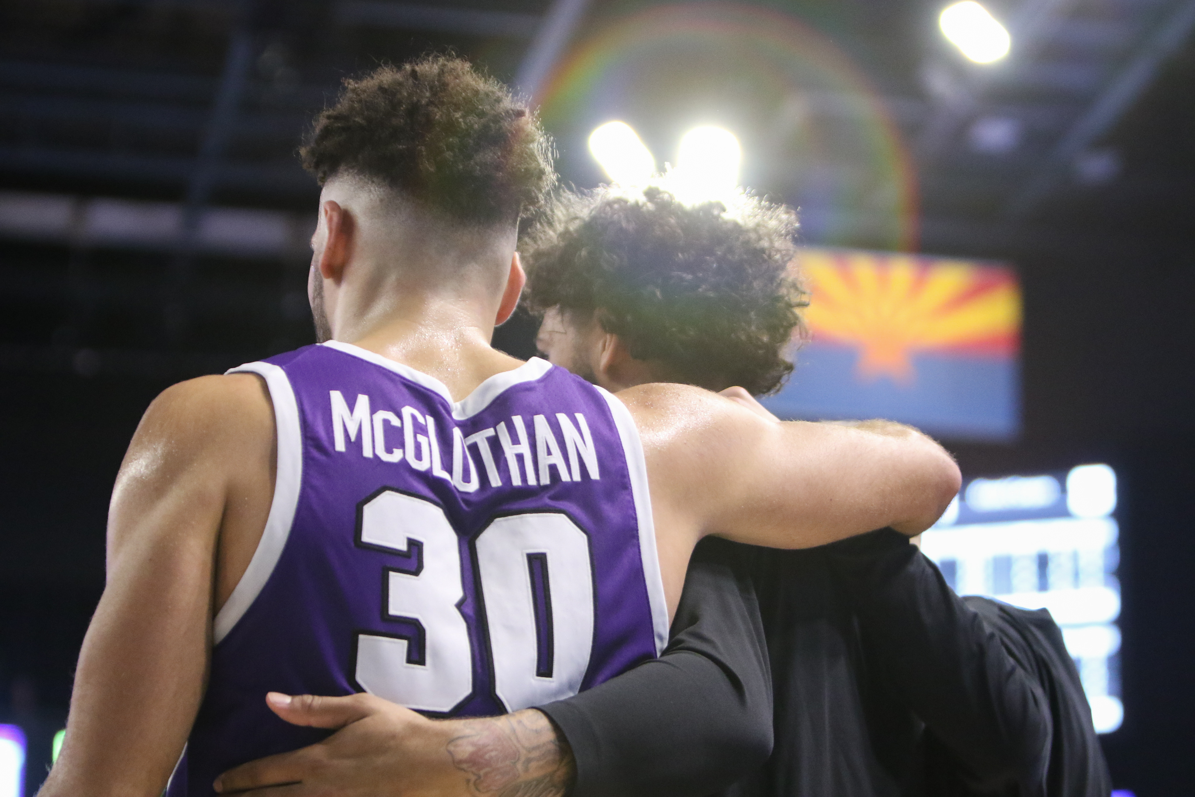 GCU's Gabe McGlothan (left) and Taeshon Cherry (right) huddle during a timeout in a basketball game against Prairie View A&M on Nov. 17, 2021 at GCU Arena in Phoenix.