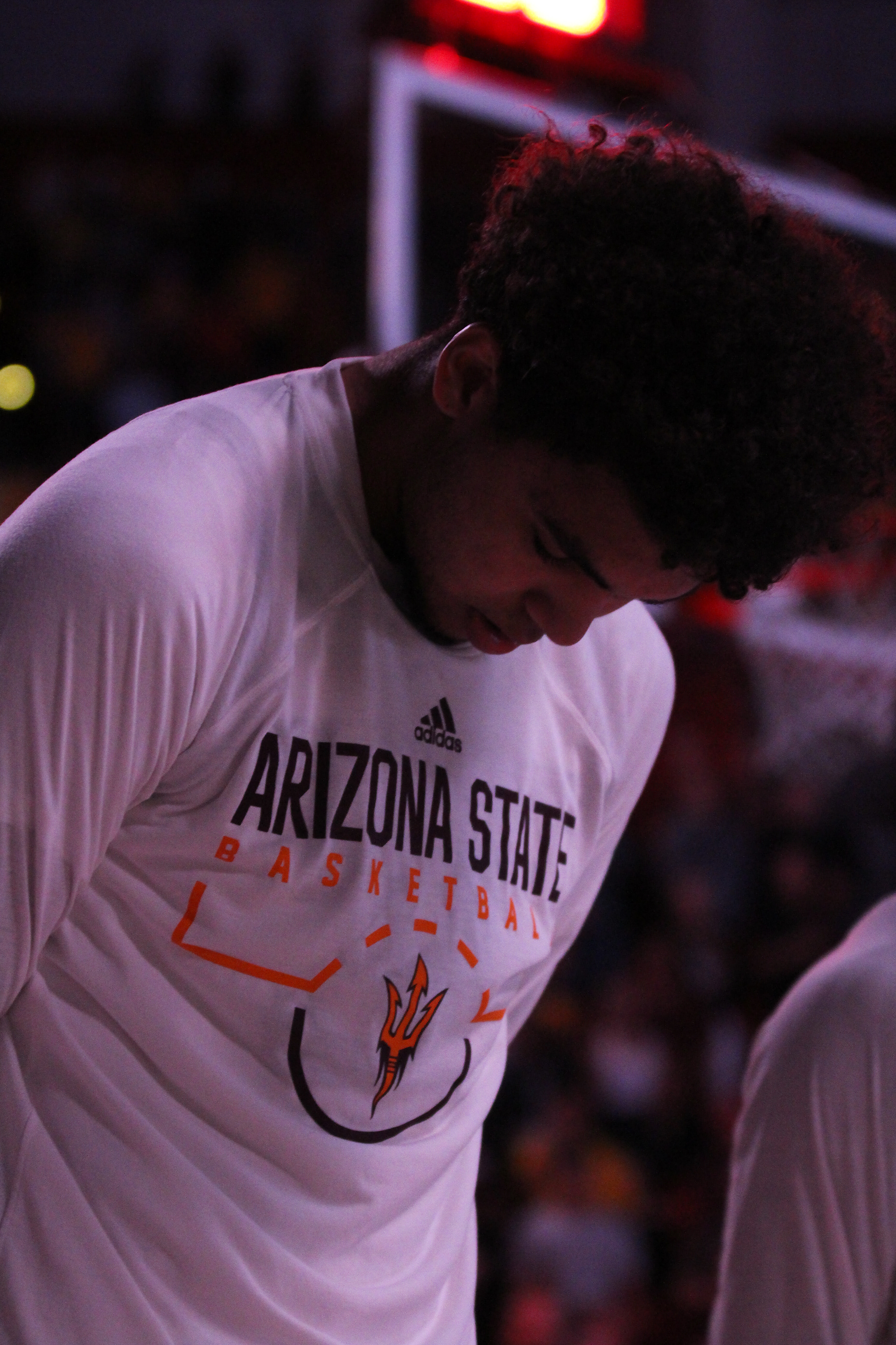 Arizona State guard Taeshon Cherry bows his head as the national anthem is performed before a game against Central Connecticut State on Nov. 14, 2019, at Desert Financial Arena in Tempe, Ariz.