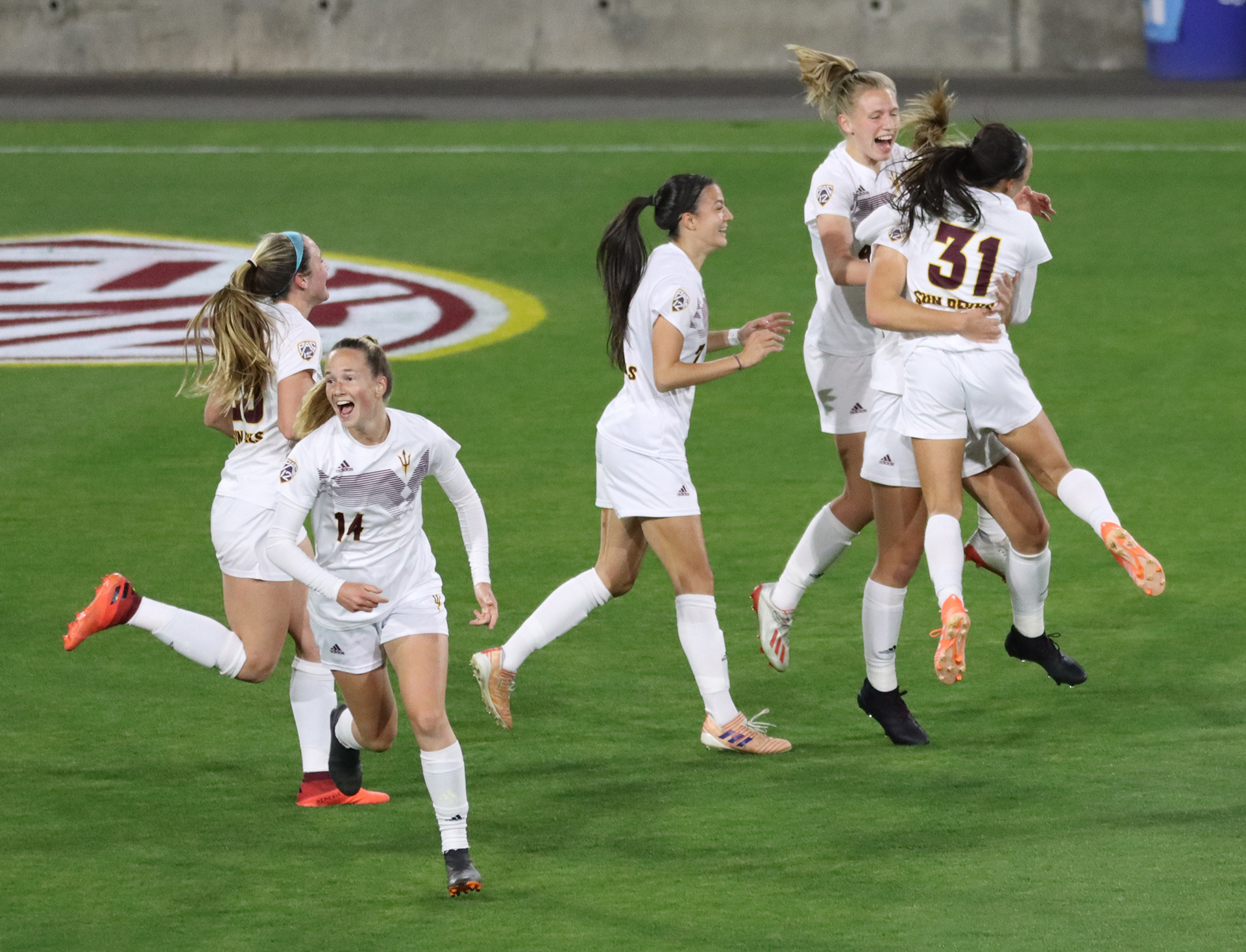 Arizona State soccer players celebrate a go-ahead goal in a match against USC on Feb. 26, 2021 at Sun Devil Stadium in Tempe, Ariz.