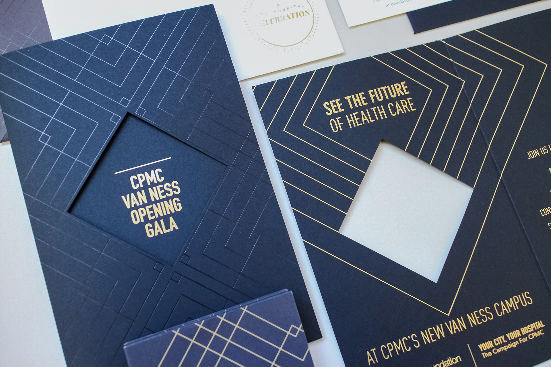 Close up of invitation suite showing diecut, spot gloss and gold ink.