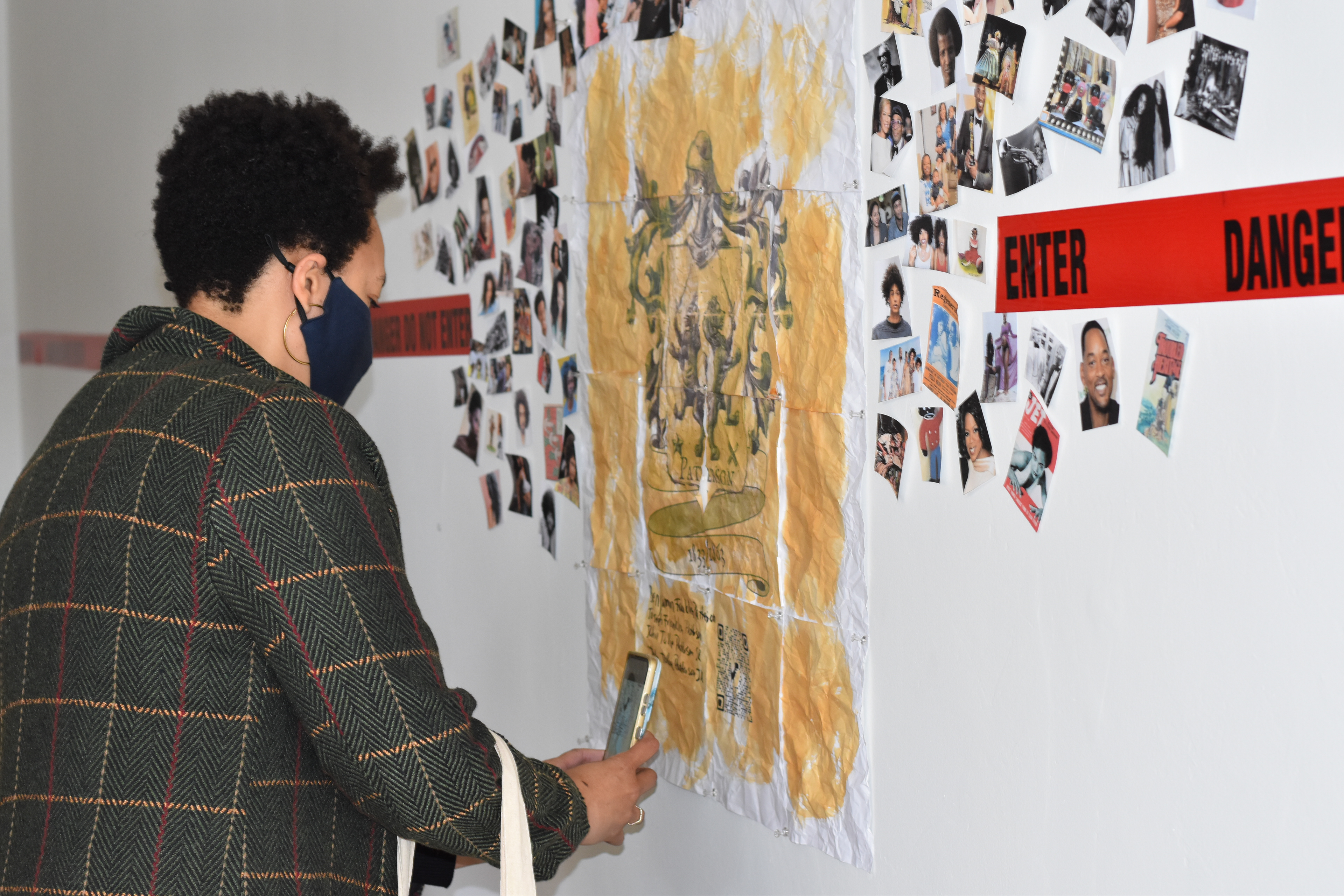 A viewer scanning the QR code which gives the viewer access to more information about What You/See What I See