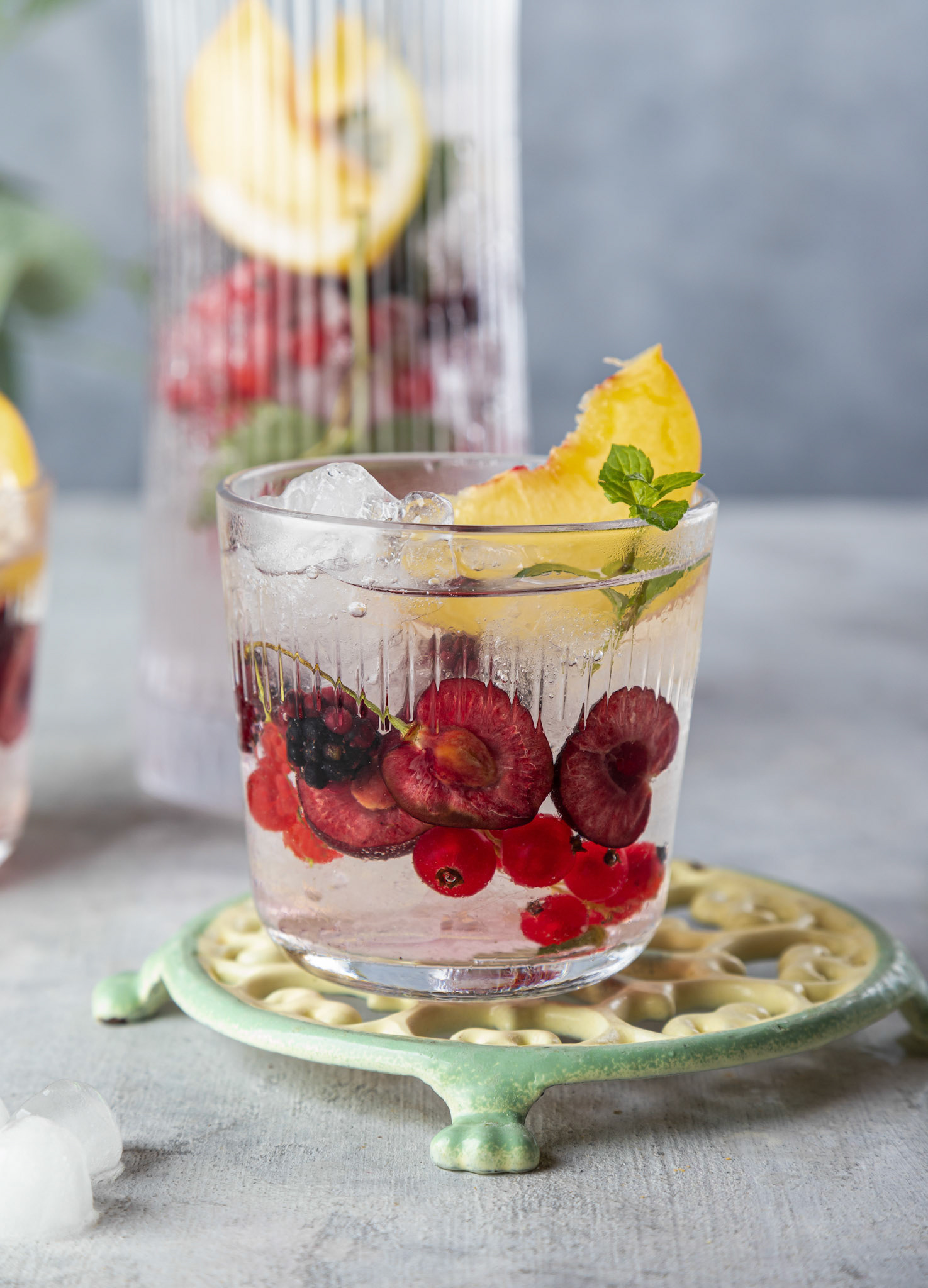 Fresh summer lemonade with berries and fruits . Raw vegan detox beverage .