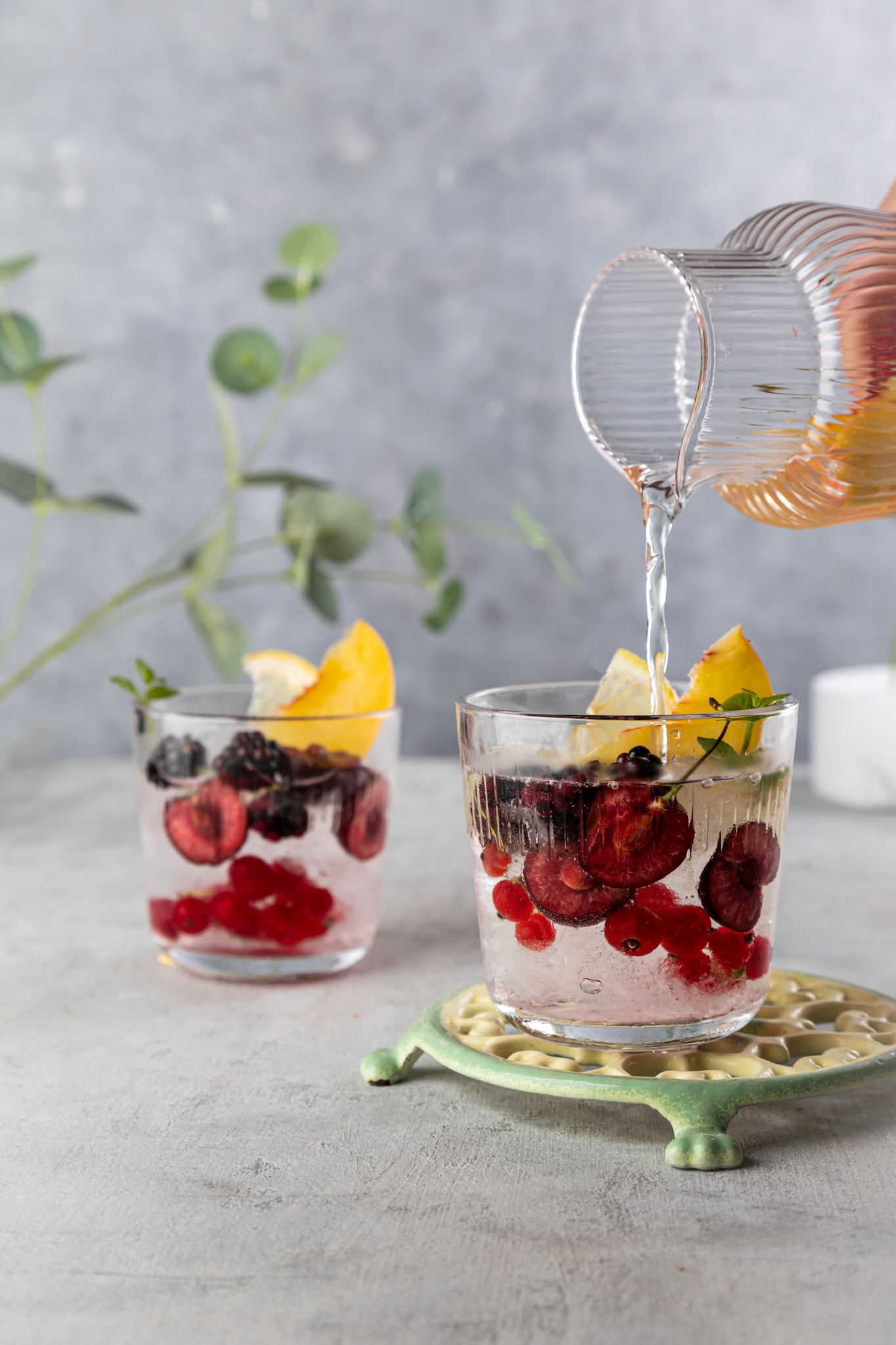 Fresh summer lemonade with berries and fruits . Raw vegan detox beverage .