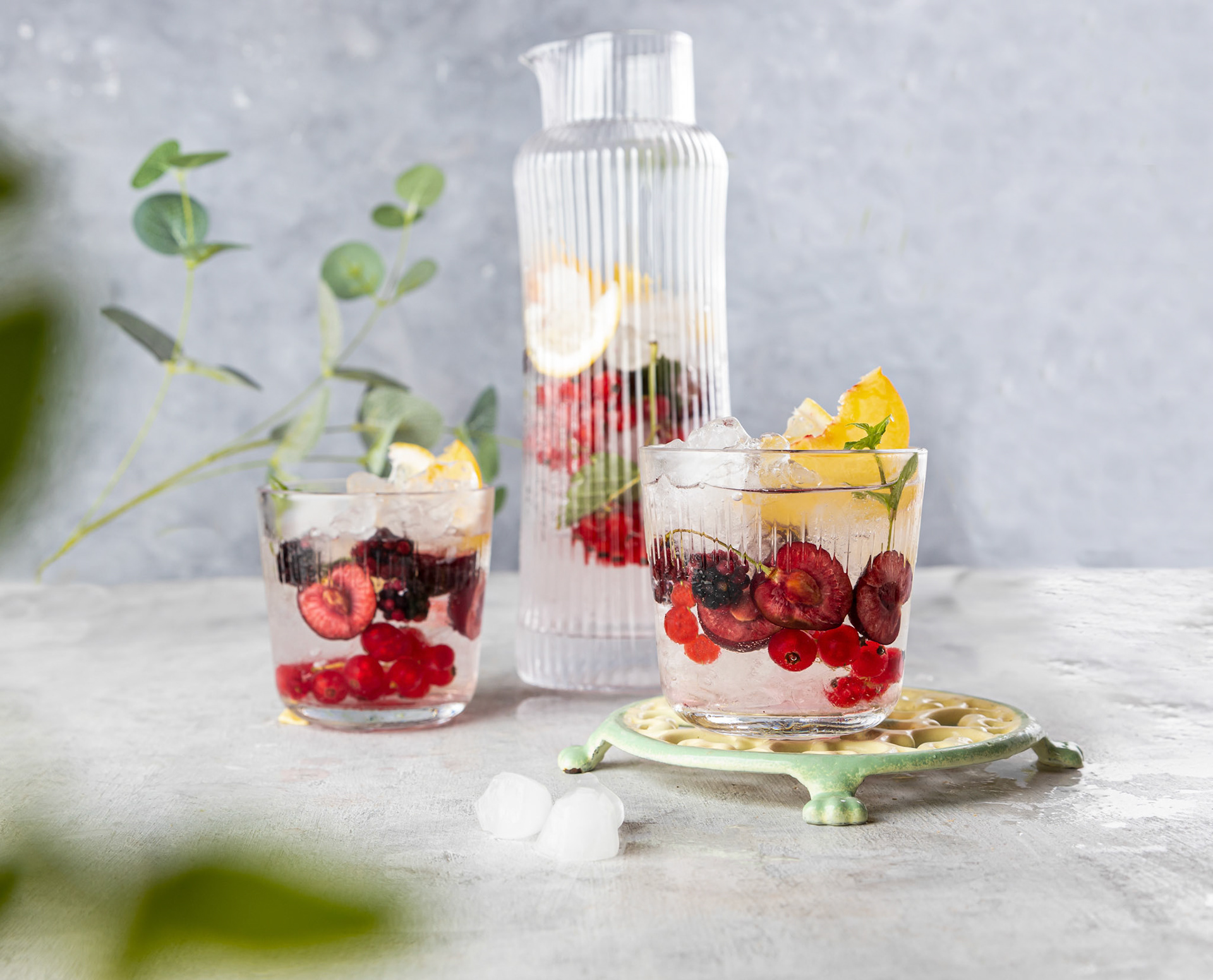 Fresh summer lemonade with berries and fruits . Raw vegan detox beverage .