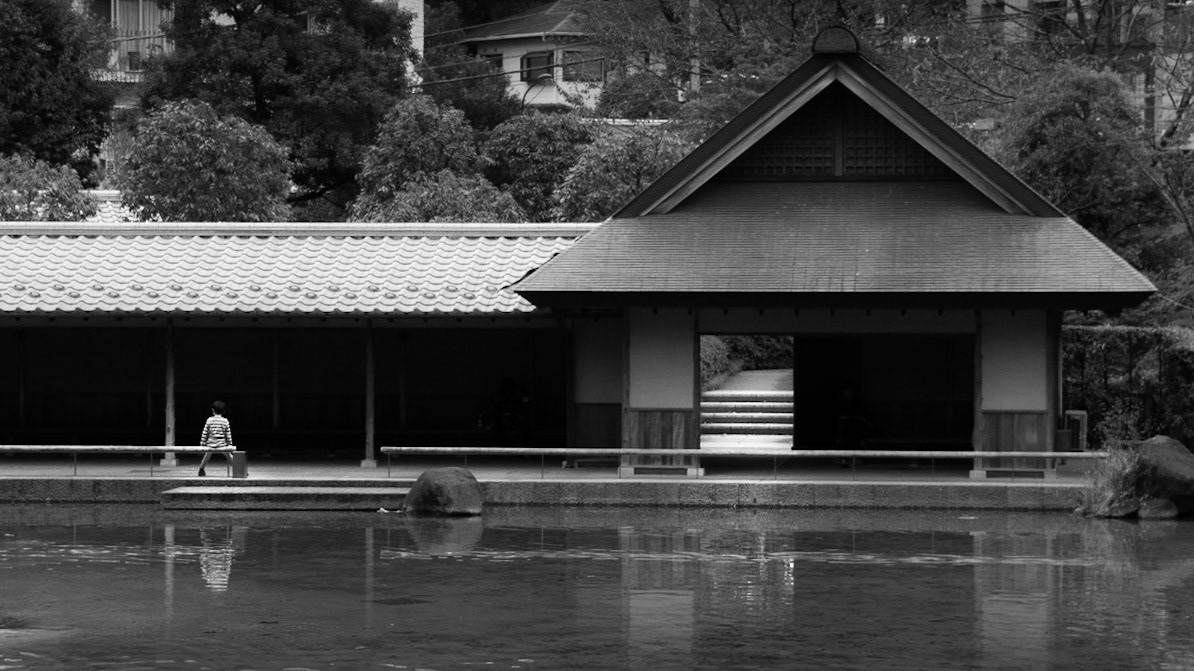 Captured by Ikeji Uju: A person sitting at a shrine in Tokyo, Japan.