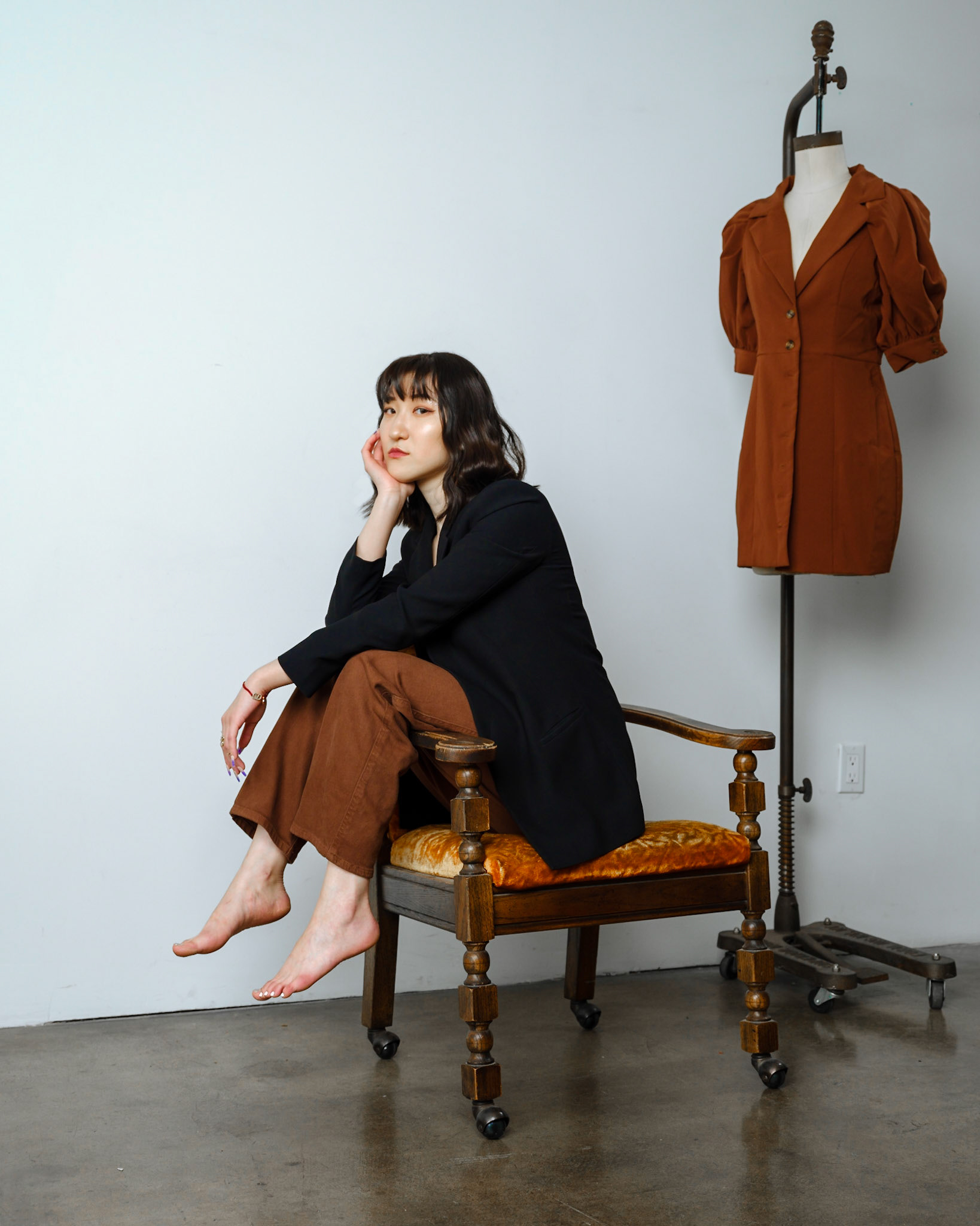 Ikeji Uju: Rae Wang exudes style in complementary blues and browns at a Los Angeles studio. Ikeji Uju Photography