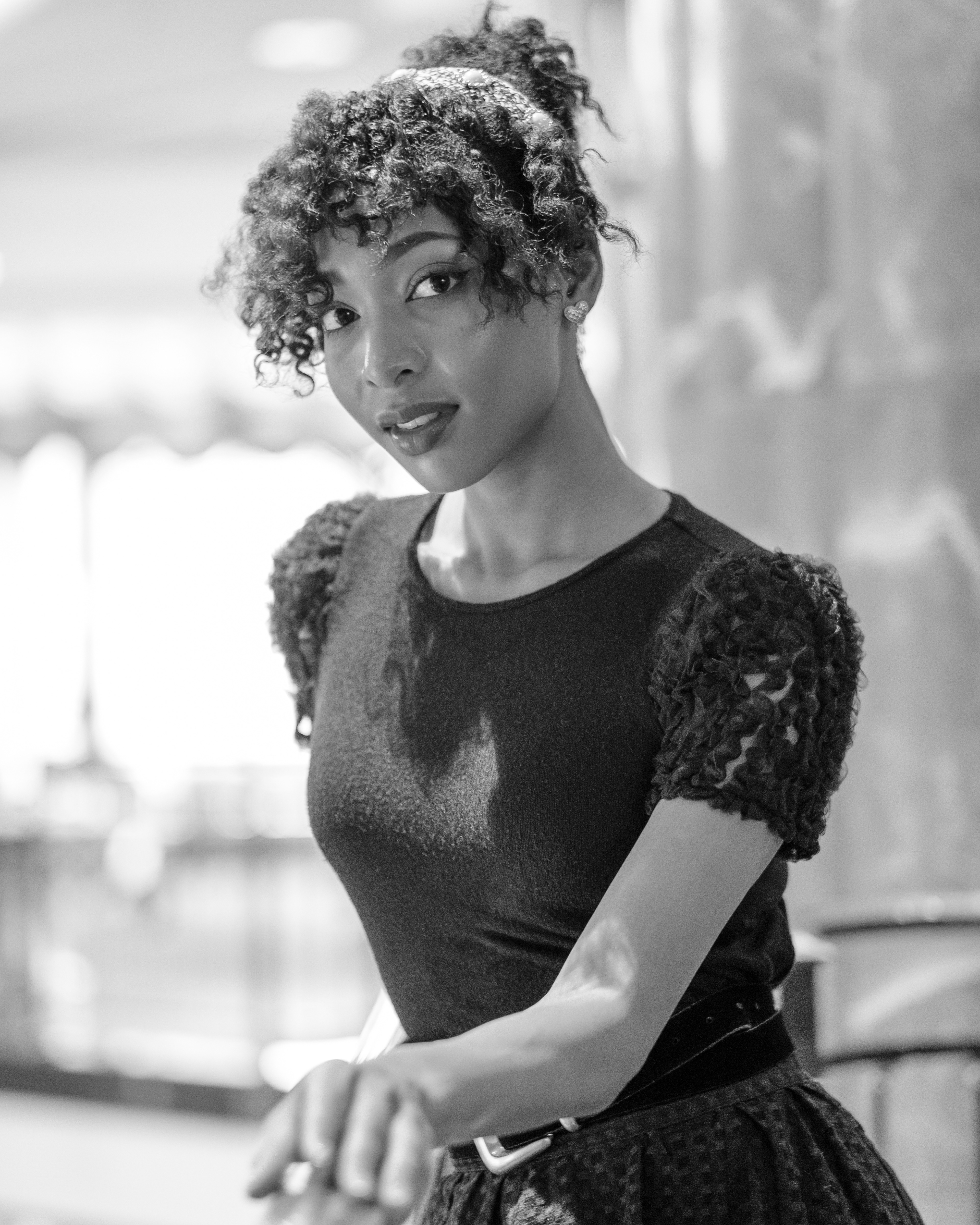Ikeji Uju: Raimu Kaminashi elegantly dressed in an all black ensemble, set against the backdrop of Meguro City, Tokyo, Japan. Shot in Black and White. Ikeji Uju Photography