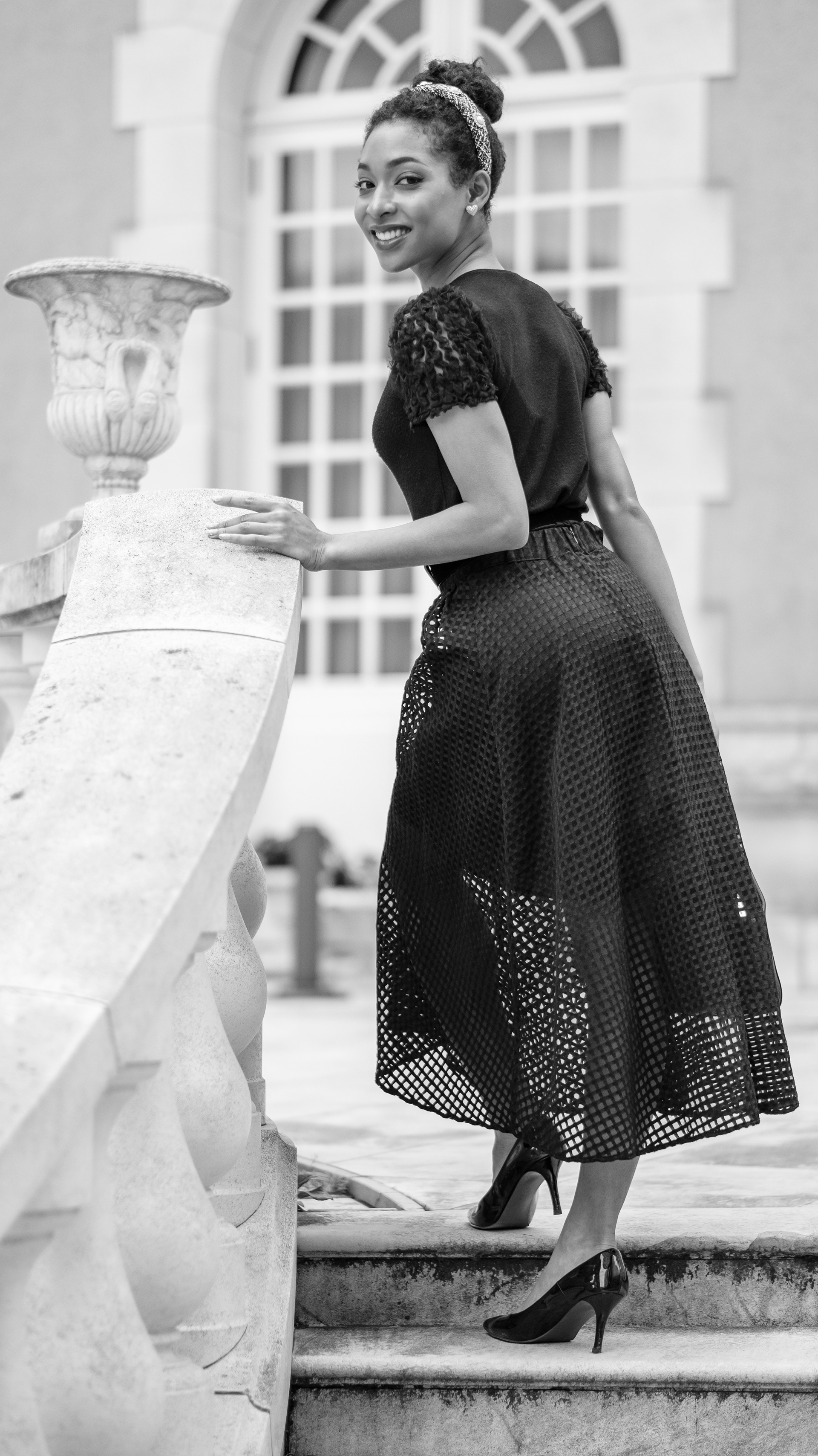 Ikeji Uju: Raimu Kaminashi elegantly dressed in an all black ensemble, set against the backdrop of Meguro City, Tokyo, Japan. Shot in Black and White. Ikeji Uju Photography