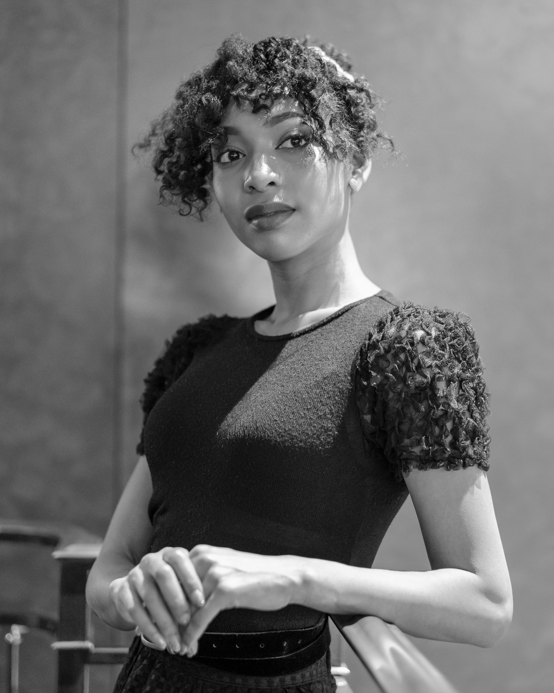 Ikeji Uju: Raimu Kaminashi elegantly dressed in an all black ensemble, set against the backdrop of Meguro City, Tokyo, Japan. Shot in Black and White. Ikeji Uju Photography