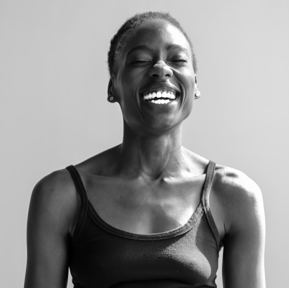 Ikeji Uju: Victoria Opemi stylishly dressed in all black with a top, jeans, and high heels. in San Francisco at a photography studio. Shot in Black and White. Ikeji Uju Photography