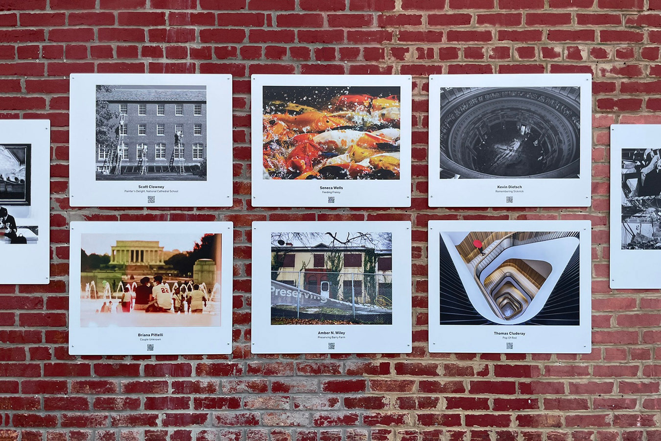 Installation view of the 16th Annual Exposed DC Photography Show, organized by ExposedDC for Ellē Alley at Lost Origins Outside, in Washington, DC, in 2022. Photo © Scott Clowney