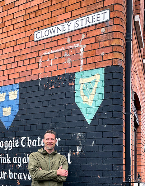 Clowney in West Belfast , Northern Ireland, on Clowney Street, where a Republican mural depicting a phoenix and references to Margaret “Maggie” Thatcher can be seen. Photo by Allen Travitz