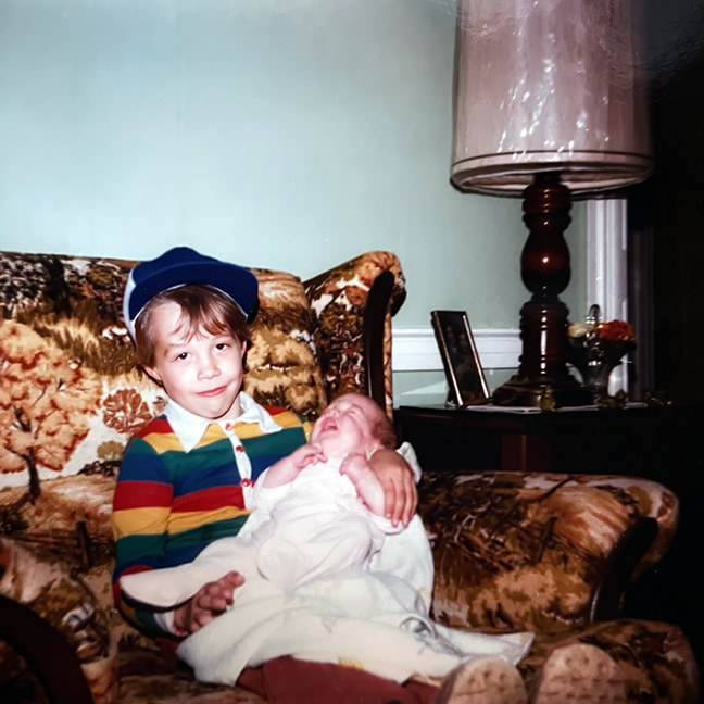 Clowney at age 5, holding his newborn cousin in 1984. Photo by Joanne Clowney