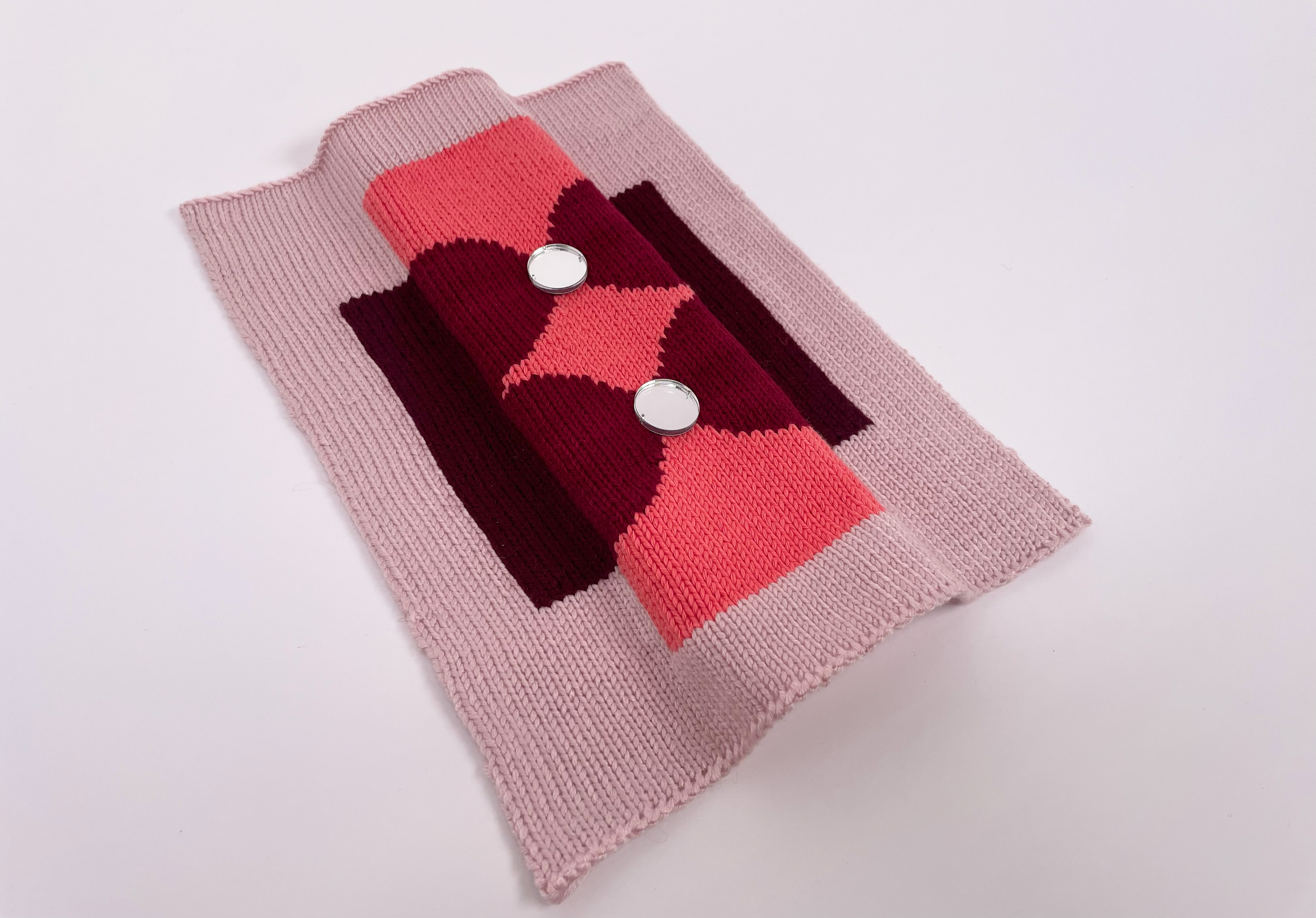 Cotton and acrylic intarsia sample with laser cut mirror detailing