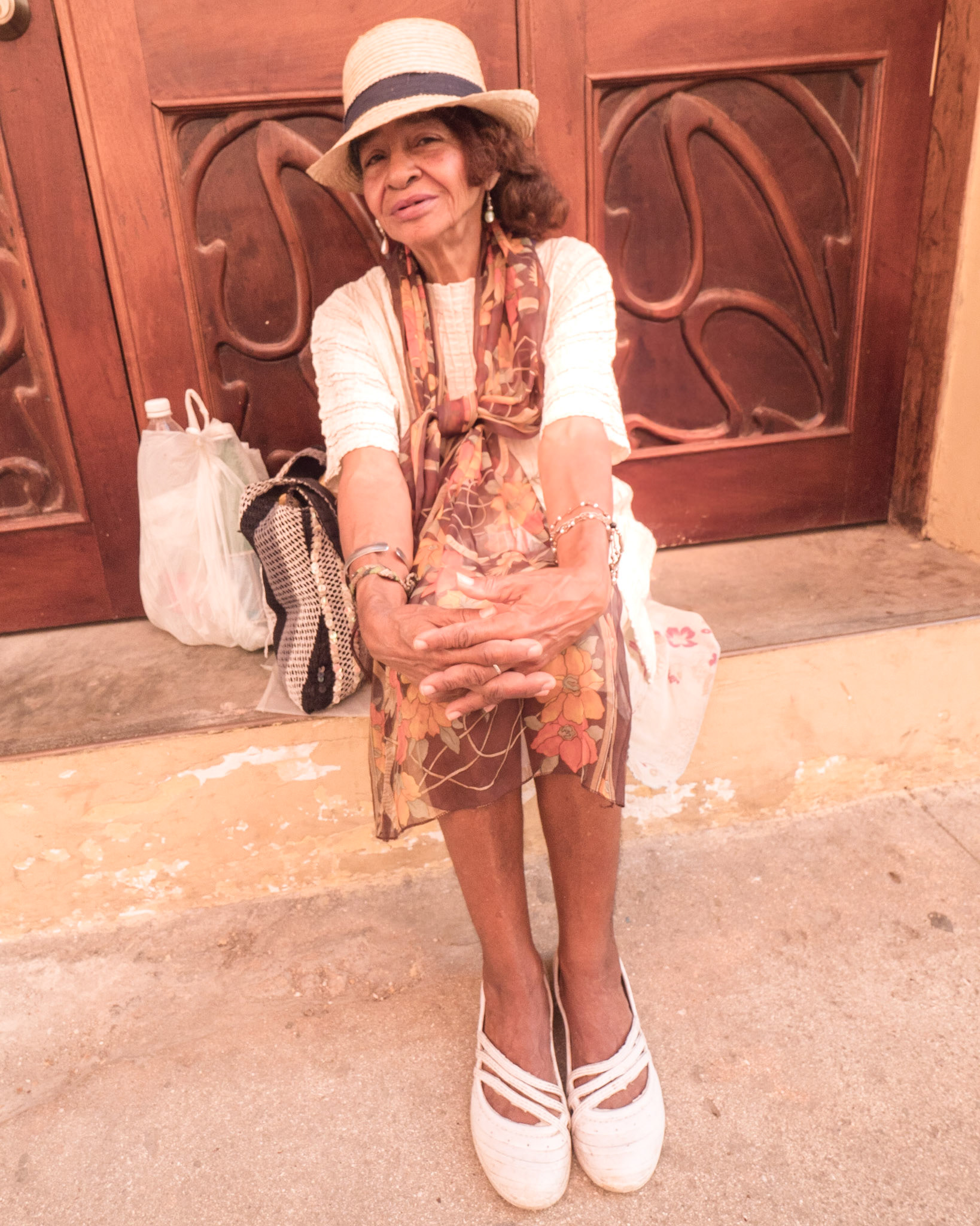 Woman Resting on Door Step, Havana