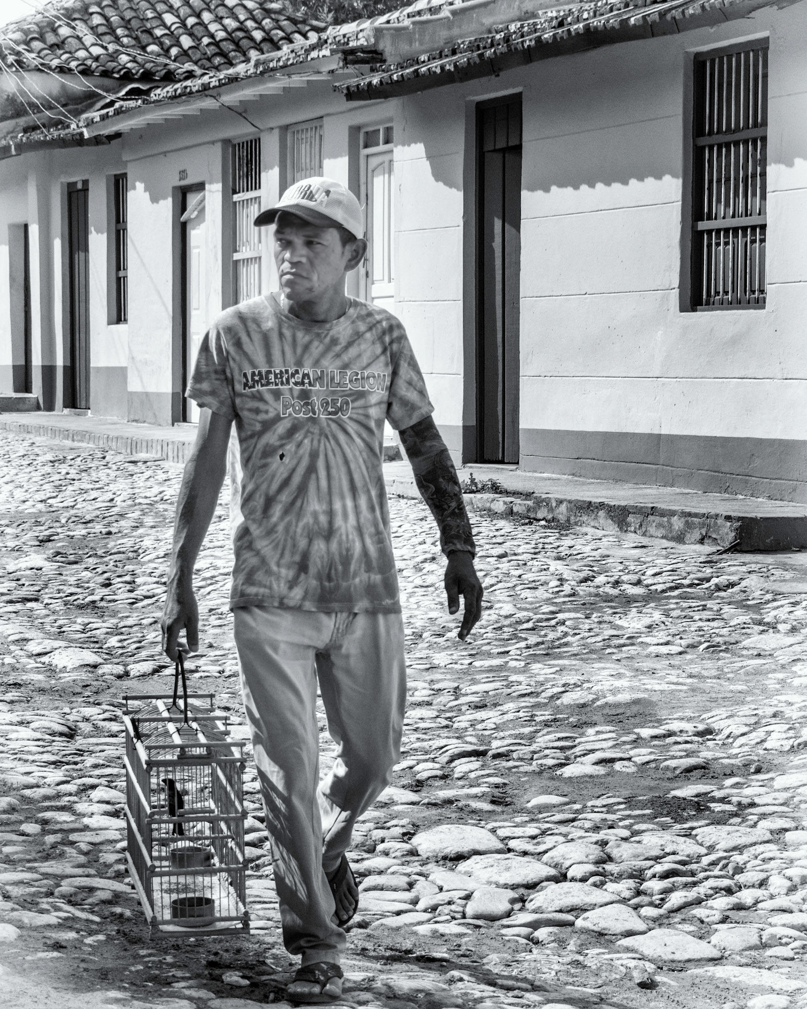 A Man Walking His Bird in Trinidad Cuba