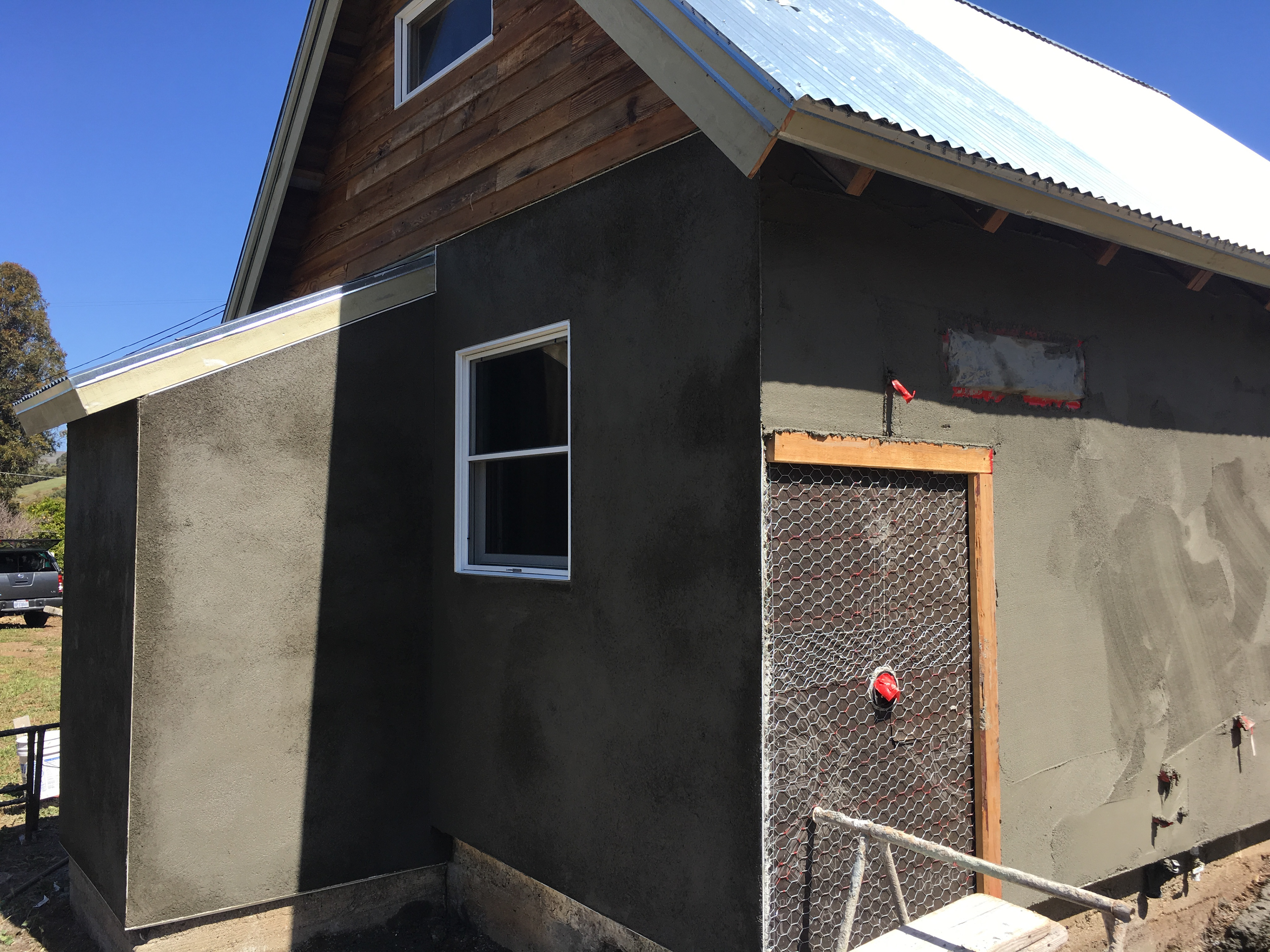 Plaster scratch coat.