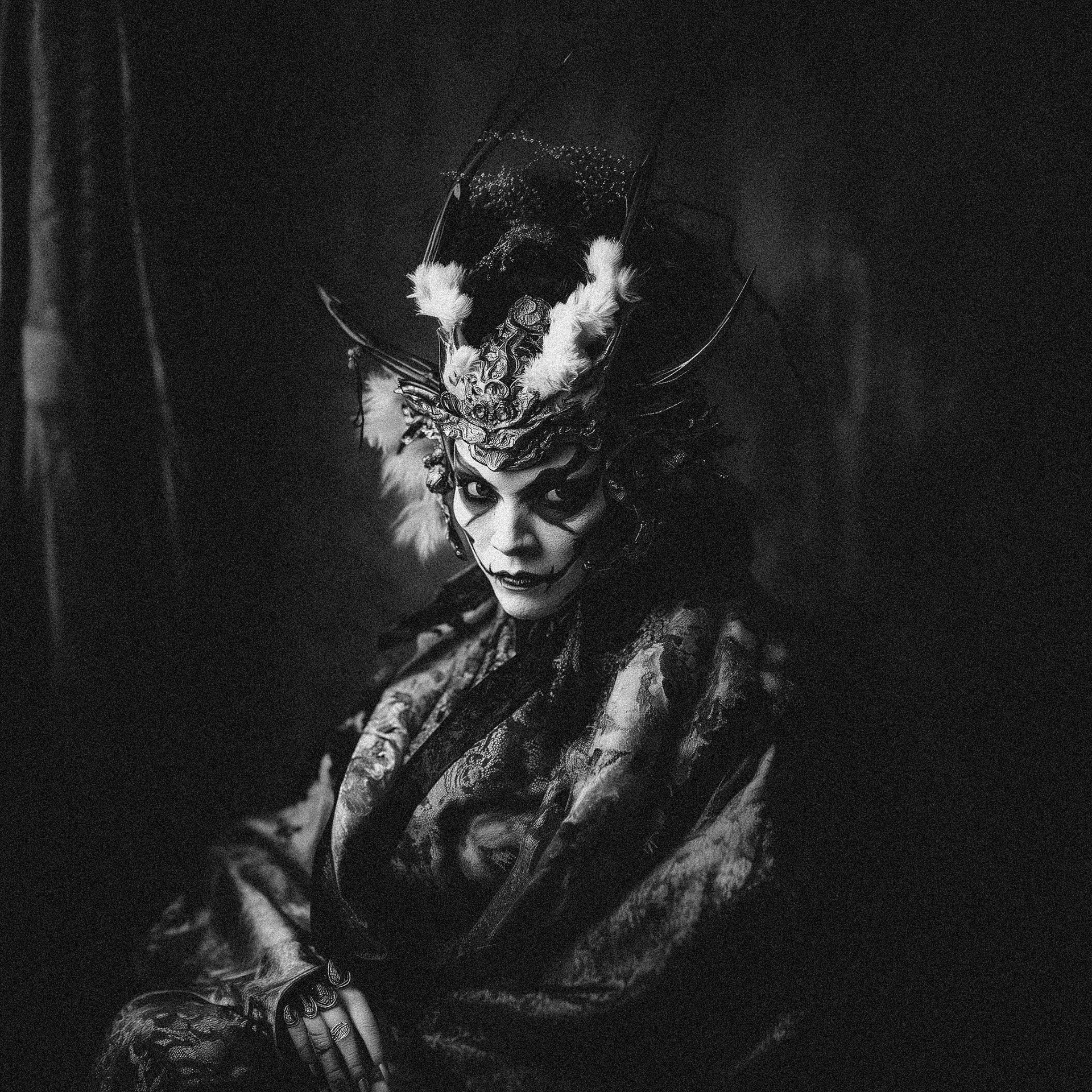 full body Portrait of a 42-year-old Japanese woman in elaborate Hannya demon costume and makeup, with intricate details capturing the fierce expression and traditional Japanese artistry. The image is taken with a Nikon Z6 and 85mm lens, in the style of Nick Knight, using Kodak Portra film simulation to create soft, warm tones with fine grain texture. The lighting is dramatic, with shadows that enhance the mystique of the demon costume, focusing on her intense gaze and the cultural symbolism. The background is subtly blurred to draw attention to her face and makeup details --v 6.1 Job ID: 97798107-5455-460f-8168-c3ed9cef1ff1
