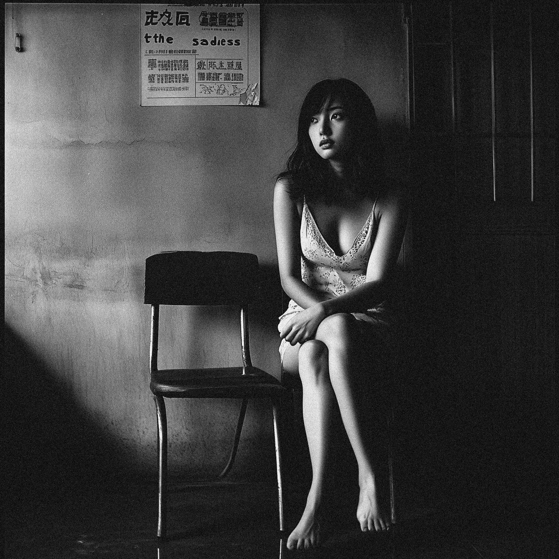 cinematic stil, body shotoff a 33 year old Japanese woman, fuji acros film sim, sitting on a chair and showing of her long legs, and flirting with the camera, fear in her eyes, in the style of the Taiwanese movie "the sadness" --v 6.1 Job ID: 2354c52b-c102-4fae-8b42-6b4f219f3025