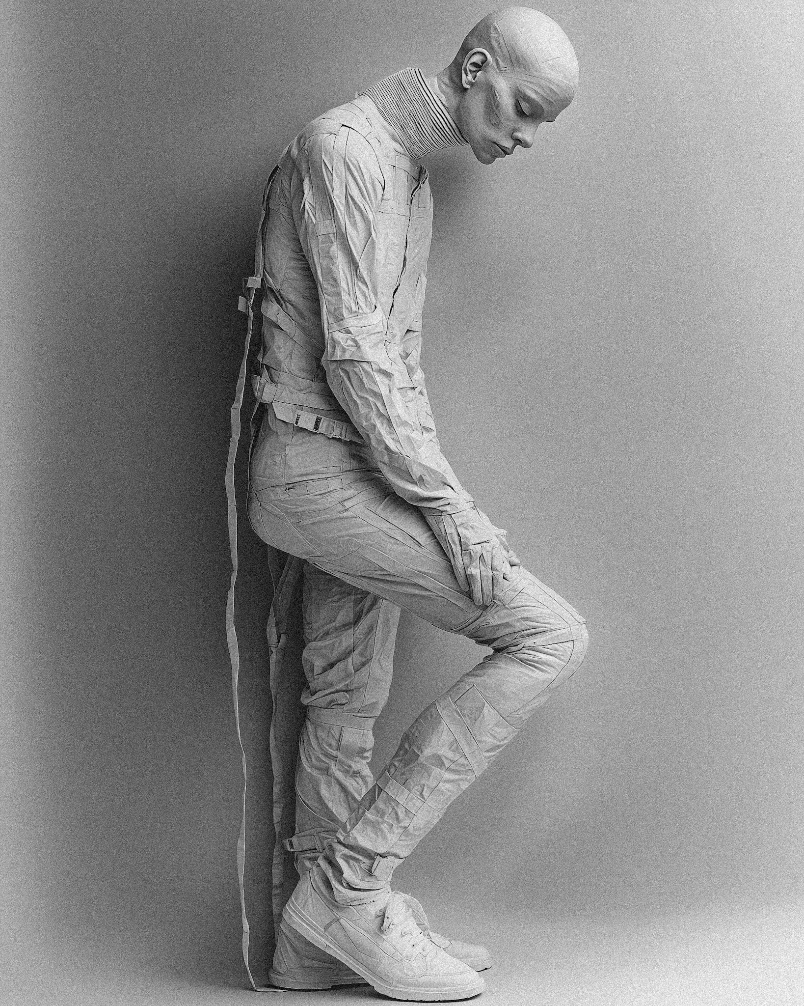 Full-body black and white portrait of a 42-year-old European woman with extremely pale skin, captured with a large-scale plate camera. The image is in the style of Nick Knight, using Fuji Acros II film simulation for deep contrasts, fine grain, and a soft, timeless quality. The composition emphasizes her elegance and poised stance, with stark lighting that accentuates the texture and contours of her form. The background is minimalist to draw attention to her pale skin and refined expression --chaos 10 --ar 4:5 --quality 2 --stylize 500 --v 6.1 Job ID: 20a053af-aca2-4124-808f-3800052c1381