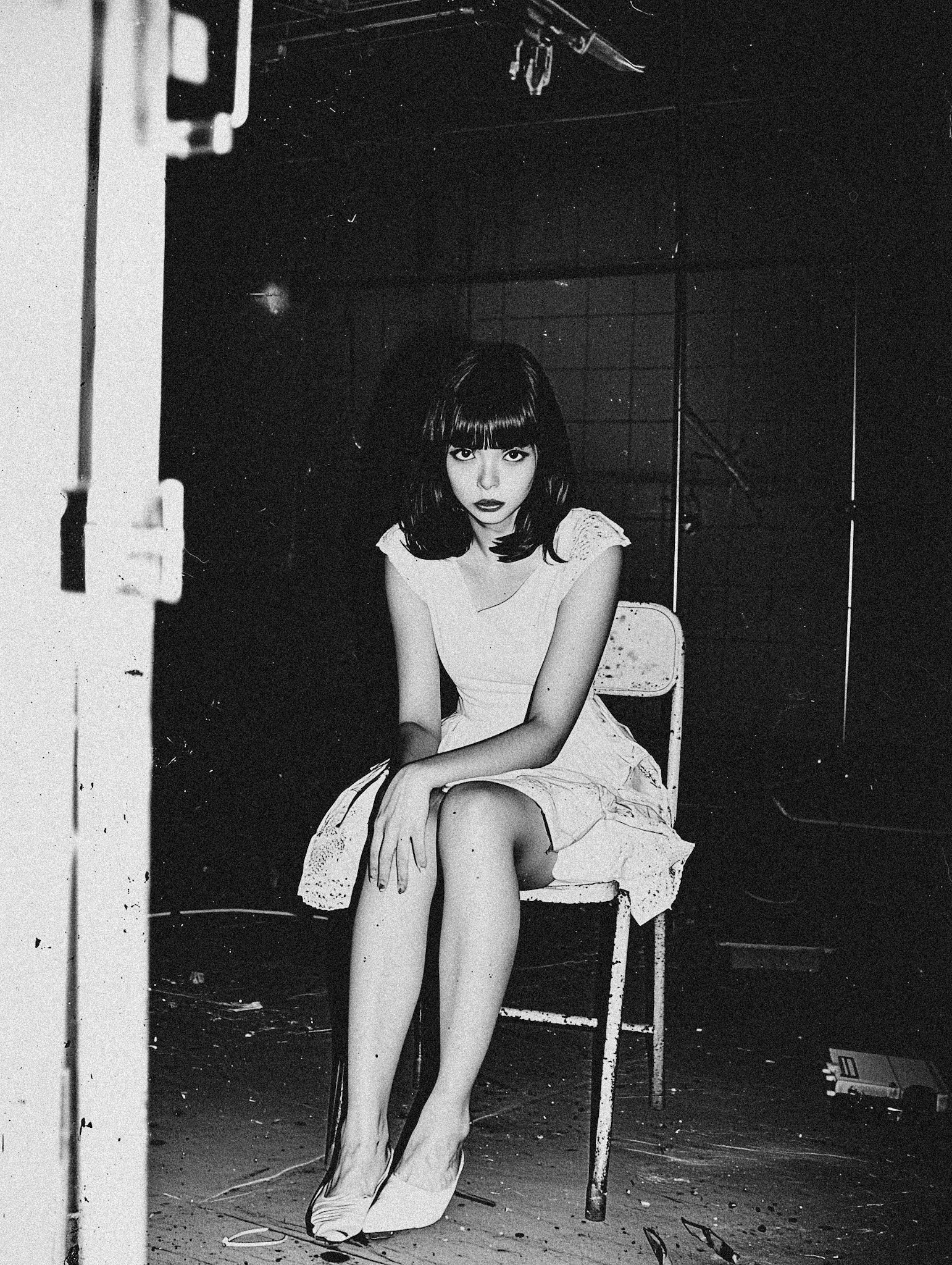 movie stil, body shotoff a 33 year old Japanese woman, fuji acros film sim, sitting on a chair and showing of her long legs, and flirting with the camera, fear in her eyes --ar 3:4 --quality 2 --style raw --profile 3meuale --v 6.1 Job ID: f3da9c72-b166-491c-b1e9-a9deb19899e0