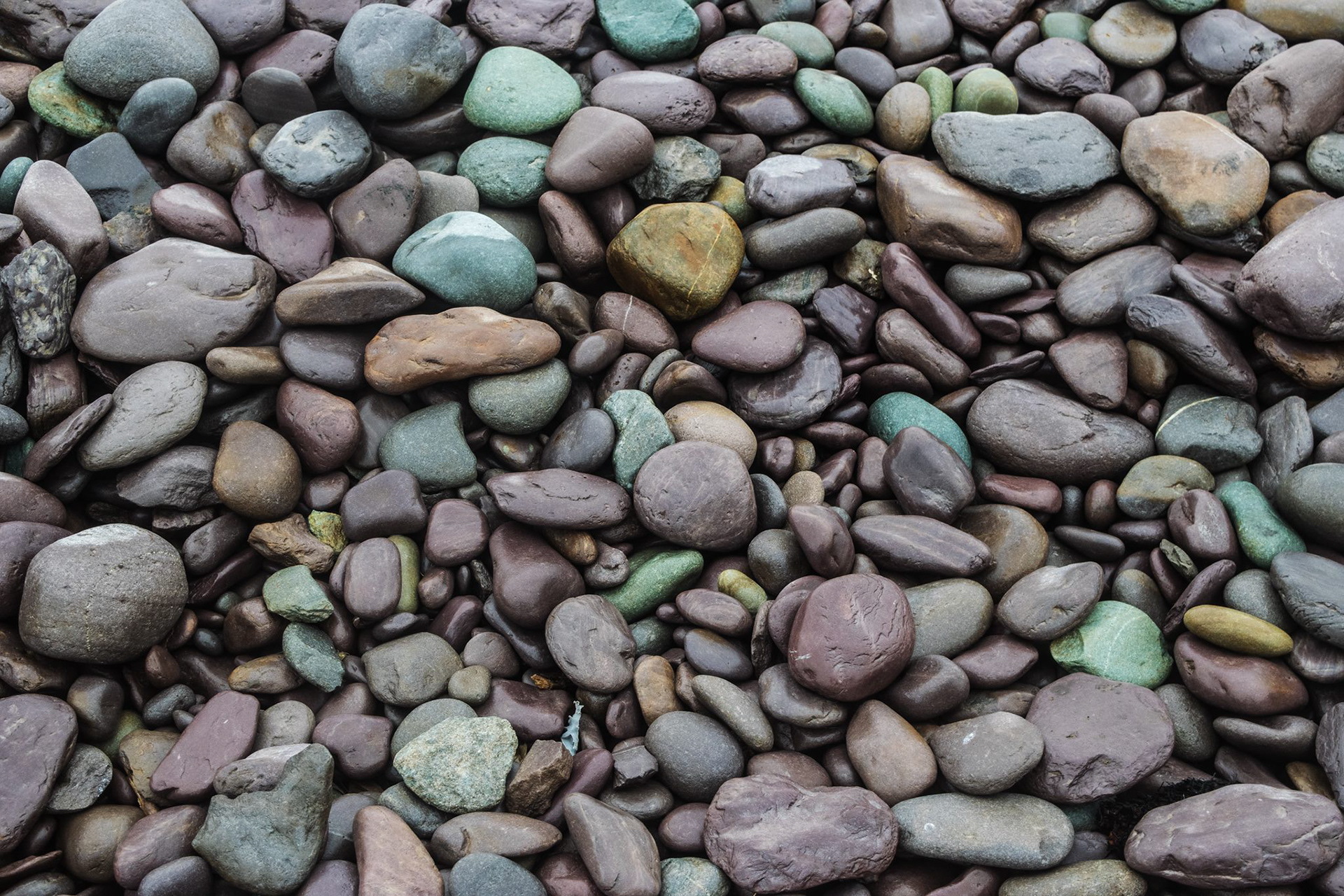 Colorful stones, beach of Waterville in Ireland.