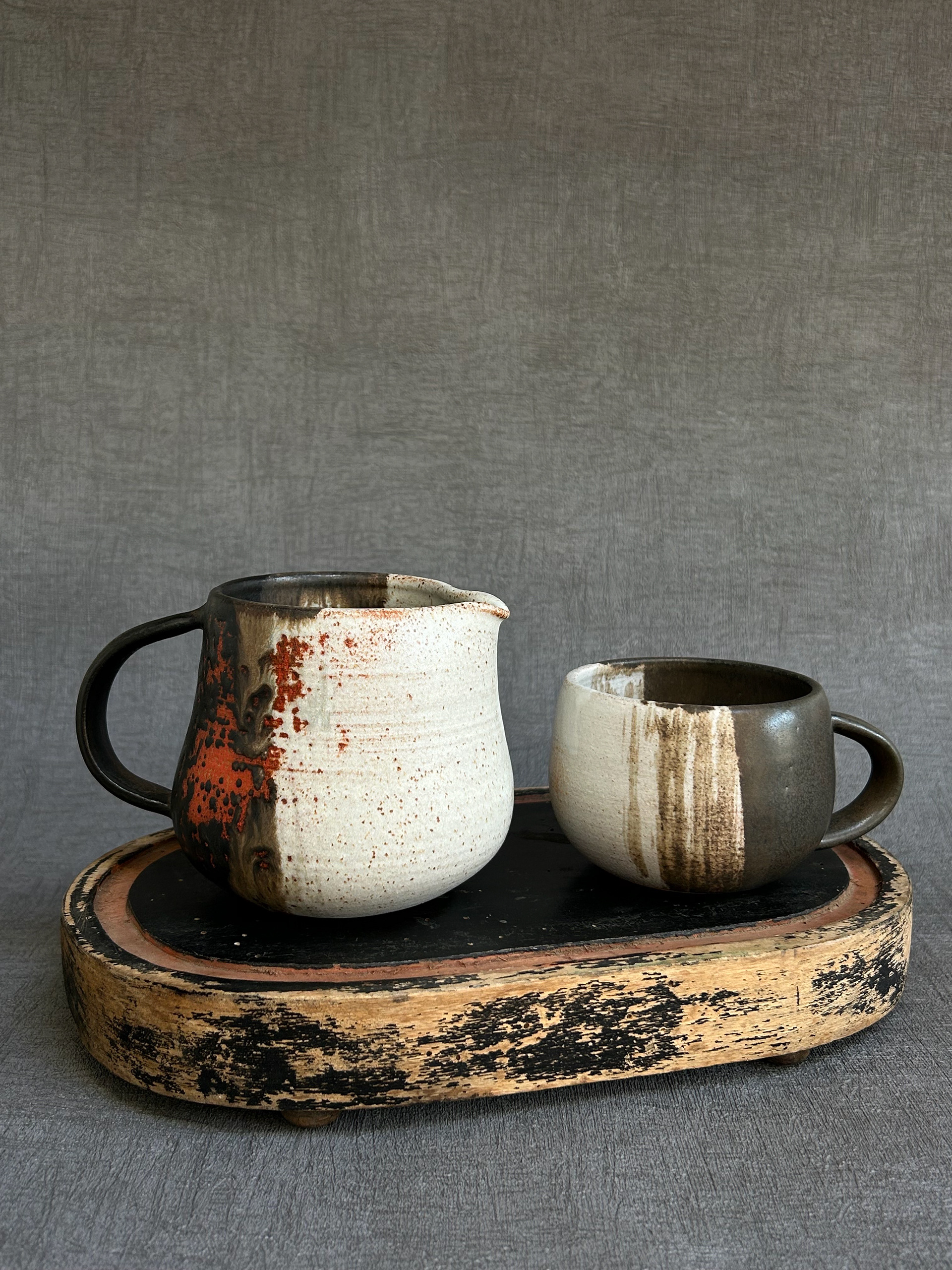 red and black jug and mug